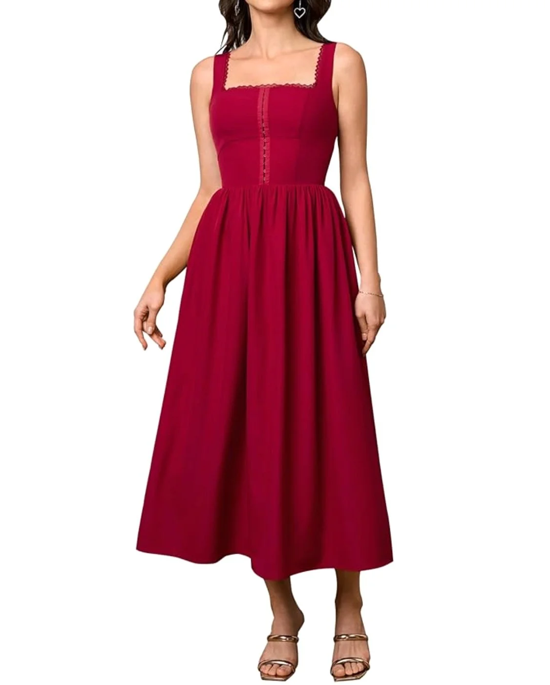 Woman wearing a sleeveless, red, spaghetti strap, floor-length dress with a square neckline and lace details.