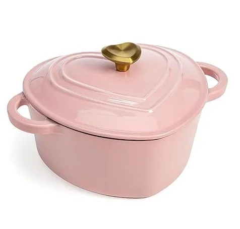 Pink heart-shaped ceramic casserole dish with a gold heart-shaped handle on the lid.