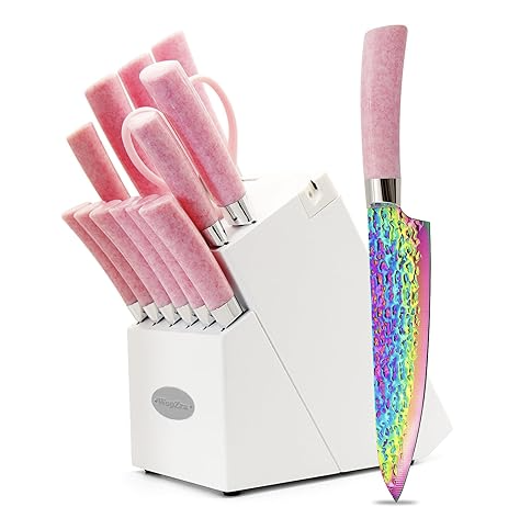 Set of pink-handled kitchen knives in a white knife block, including a rainbow-colored chef's knife with a unique design.