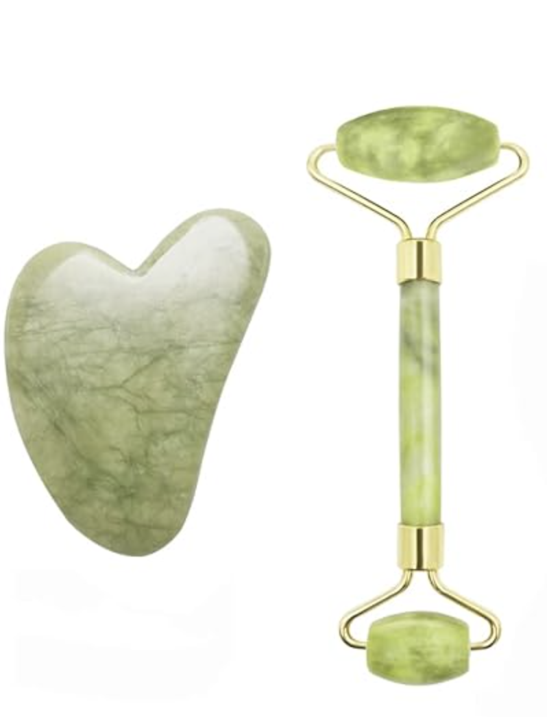 A green jade facial roller and a jade gua sha tool.