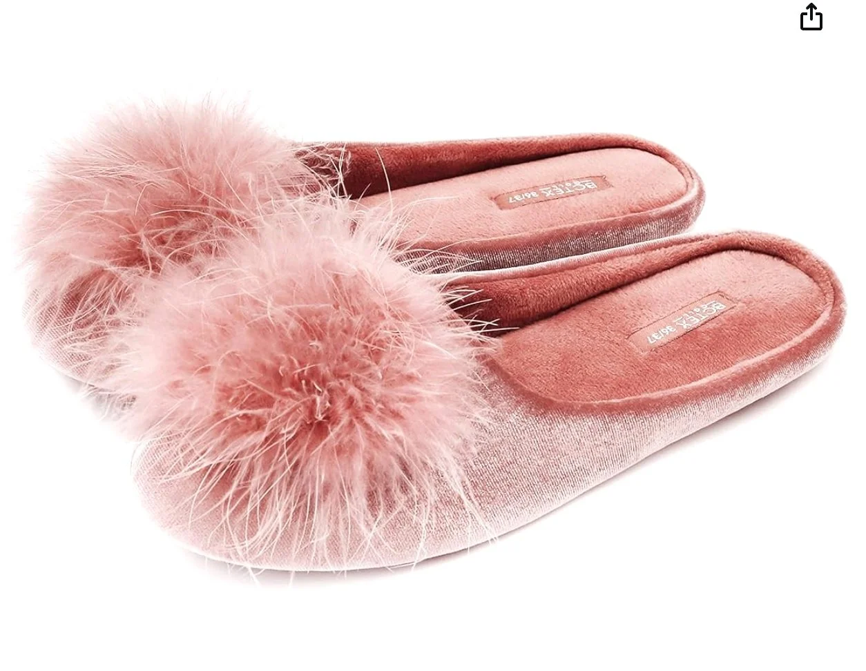 Pink slippers with fluffy pom-pom decorations on the toes.