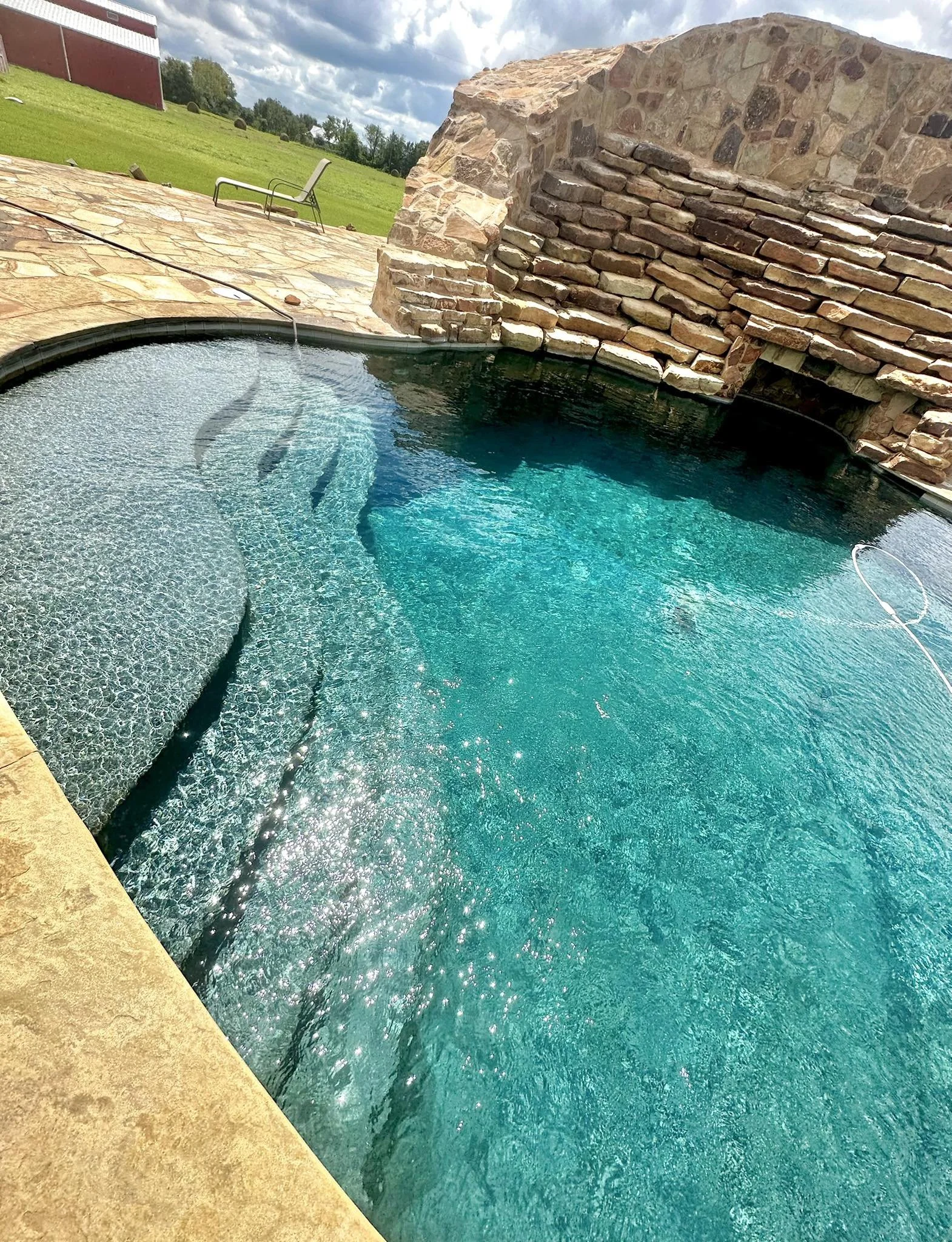Pool with stone around it.