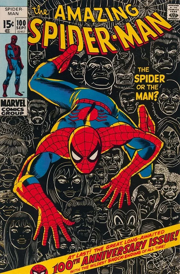 Cover of The Amazing Spider-Man comic book featuring Spider-Man crouched in front of a crowd of diverse faces, with the title at the top in bold yellow and red lettering. The cover promotes the 100th anniversary issue with a yellow banner at the bottom.
