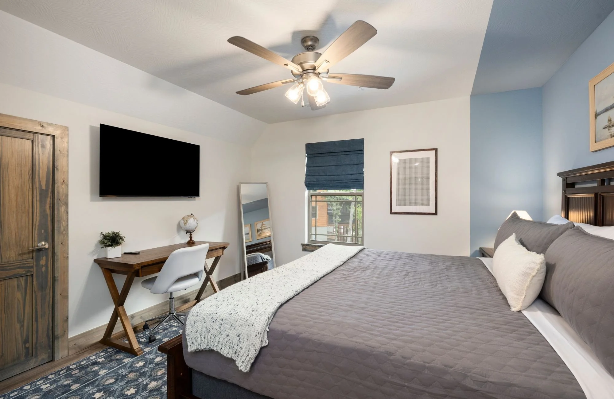 holly-jones-signature-homes-kimberling-city-mo-length-of-renovation-bedroom-with-blue-and-white-walls-comfortable-furnishings-collaborative.jpg