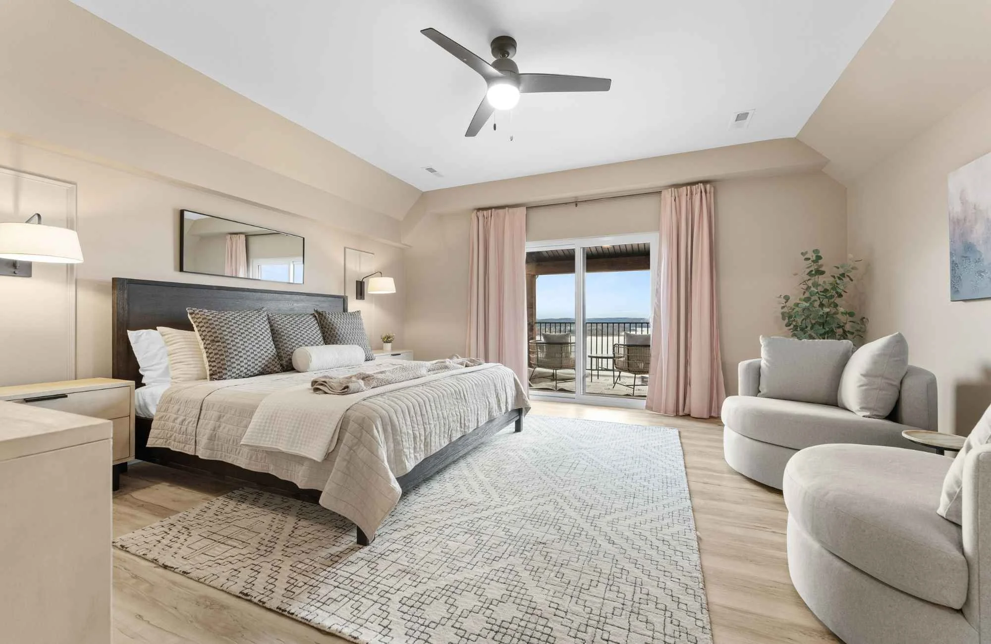 holly-jones-signature-homes-shell-knob-mo-interior-design-misconceptions-primary-bedroom-soft-neutral-colors-seating-area-doors-to-outside-vacation-home.jpg