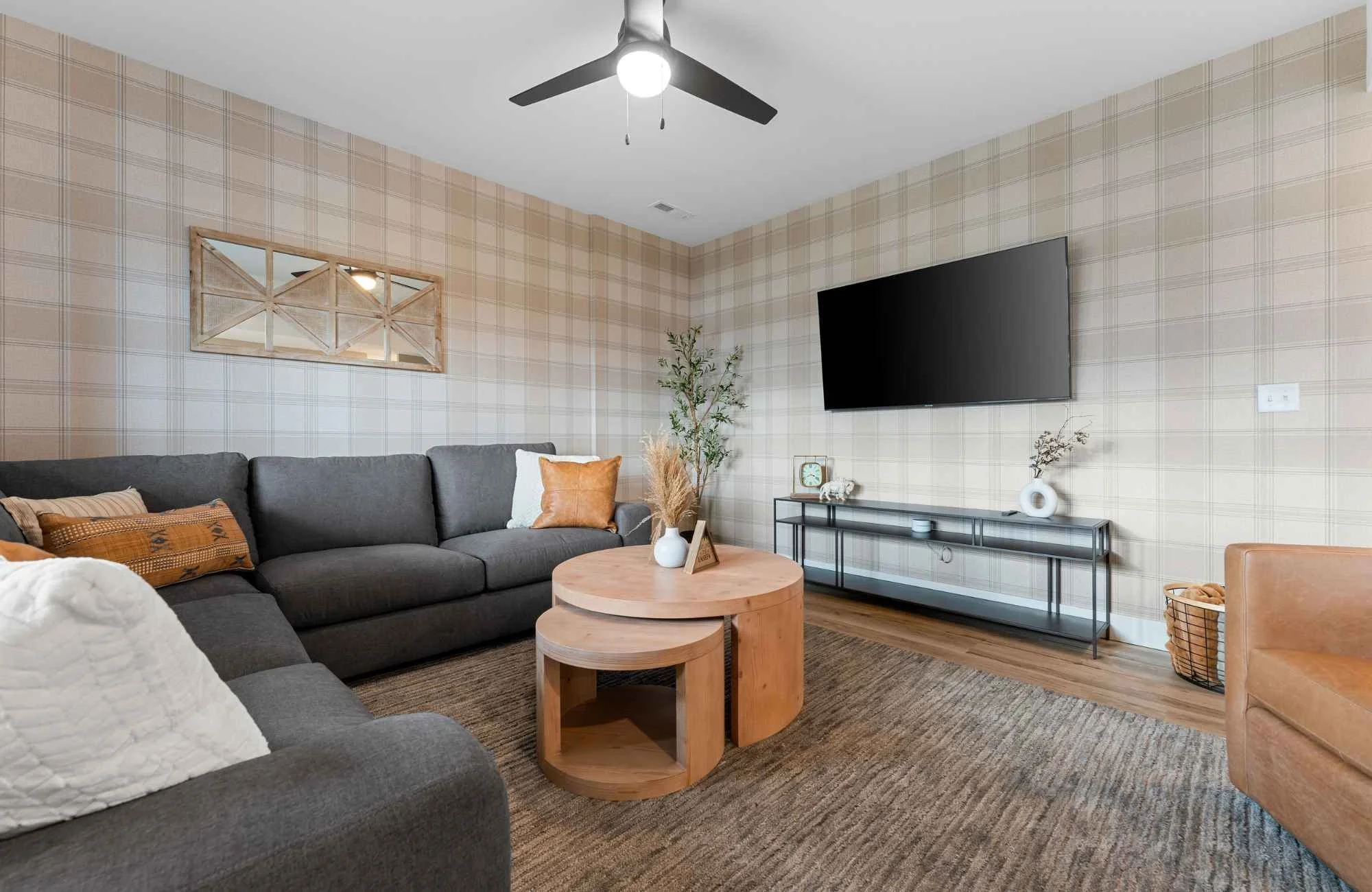 holly-jones-siganture-homes-kimberling-city-mo-interior-design-misconceptions-cozy-living-room-plaid-wallpaper-comfortable-sectional-experienced-remodel.jpg