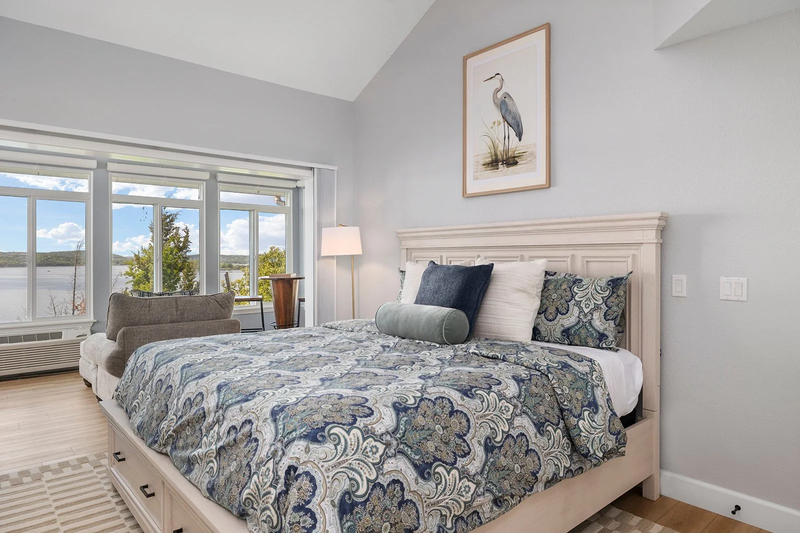 holly-jones-signature-homes-reeds-spring-mo-prep-for-design-consultation-primary-bedroom-blue-and-white-bedding-view-of-lake-classy-cozy.jpg