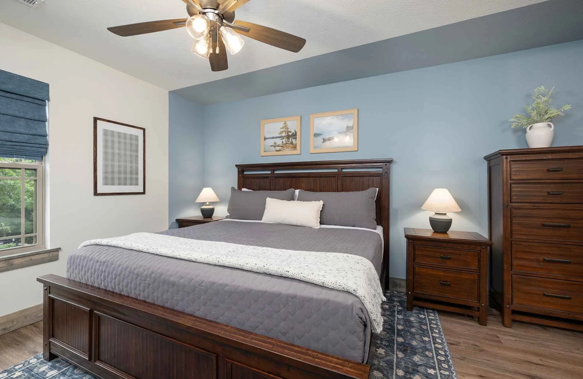 holly-jones-siganture-homes-reeds-spring-mo-choosing-colors-for-your-home-bedroom-with-uniquely-painted-blue-feature-wall-dark-stained-wood-nature-inspired.jpg