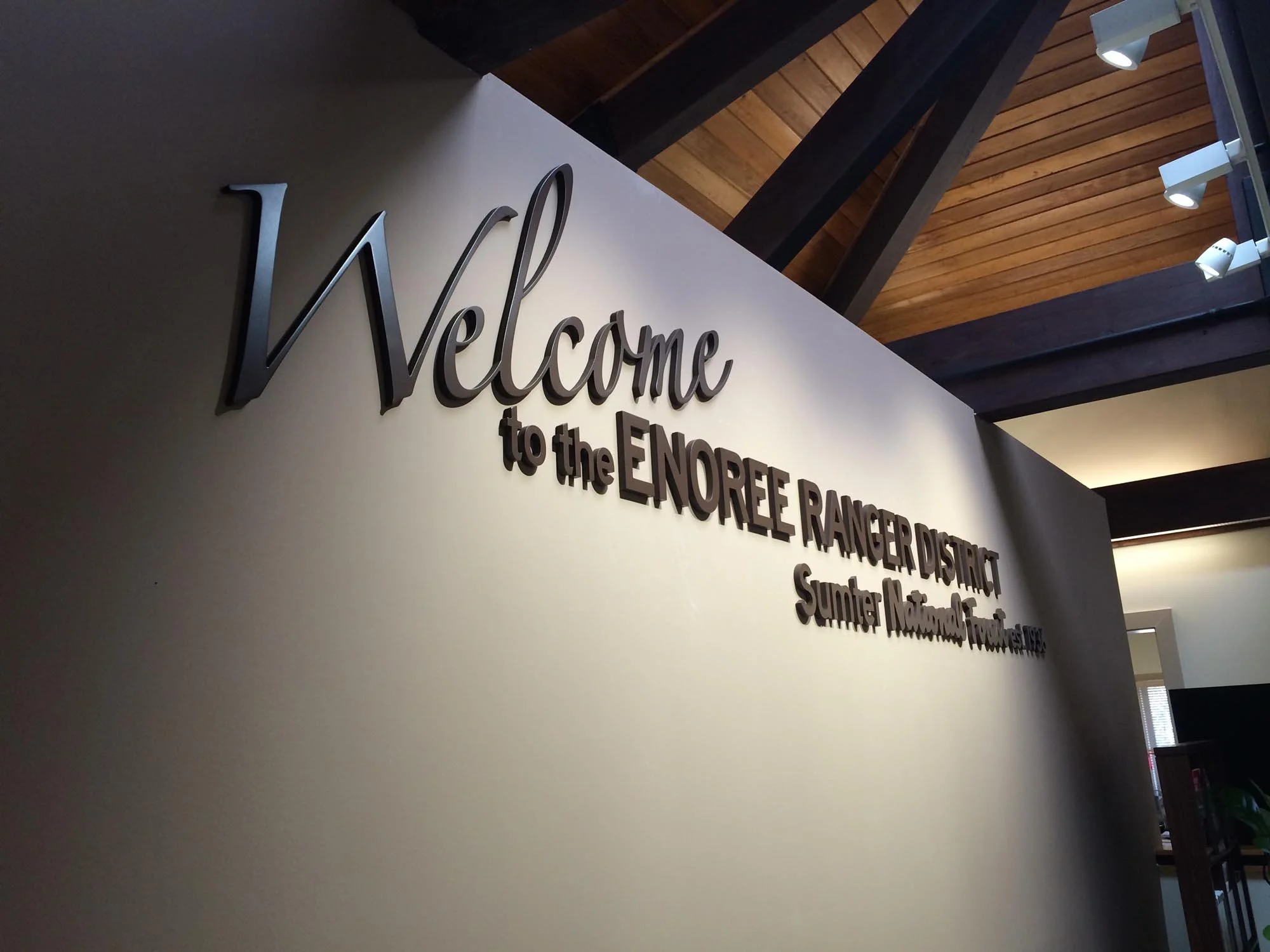 Welcome sign on a wall at the Enoree Ranger District, Sumter National Forest.