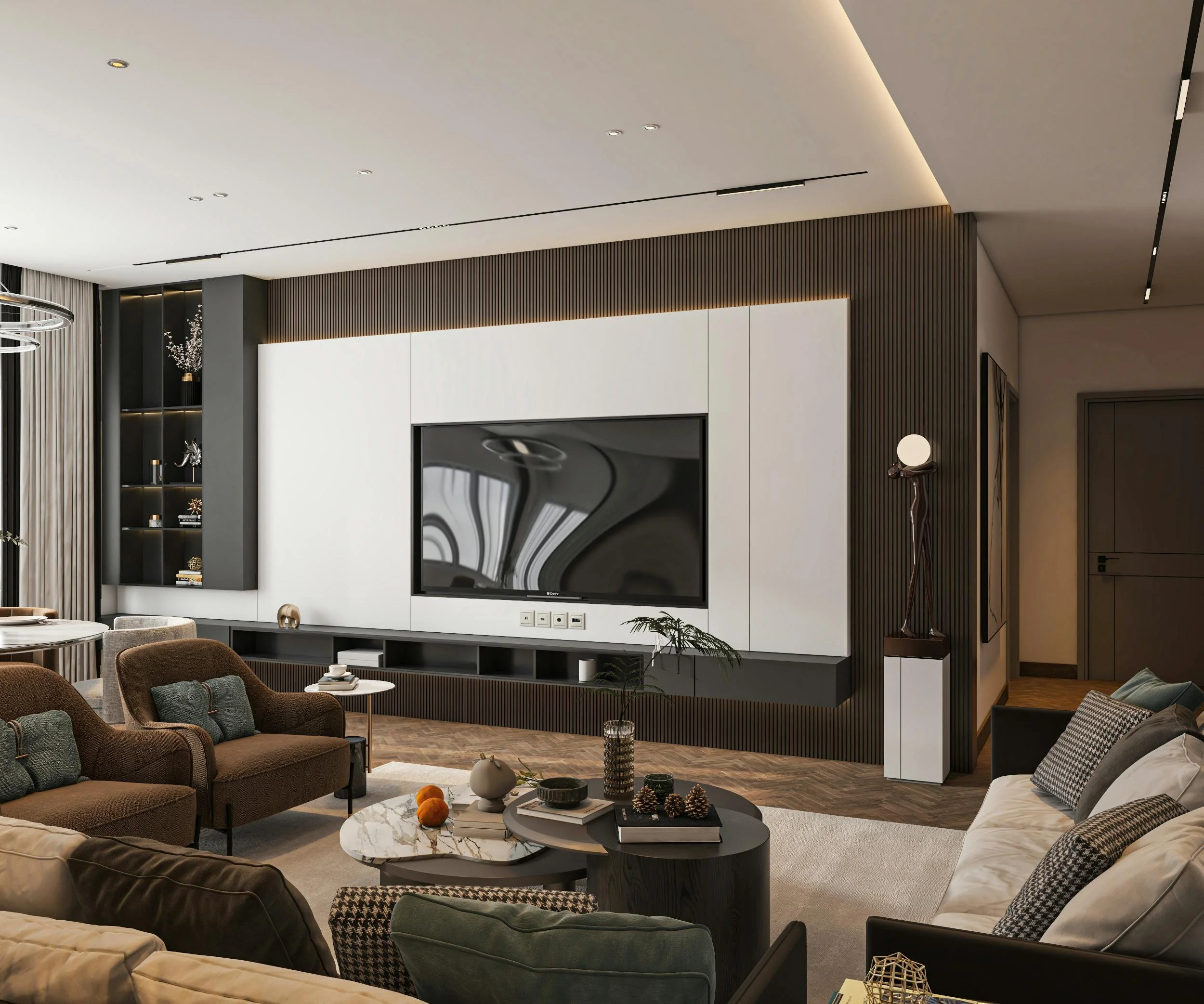 Modern living room with a large flat-screen television on a white and black wall, surrounded by sleek built-in shelving, with cozy seating, a marble coffee table, and contemporary decor.