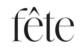 Close-up of the French word 'fête' in black lettering on a plain background.