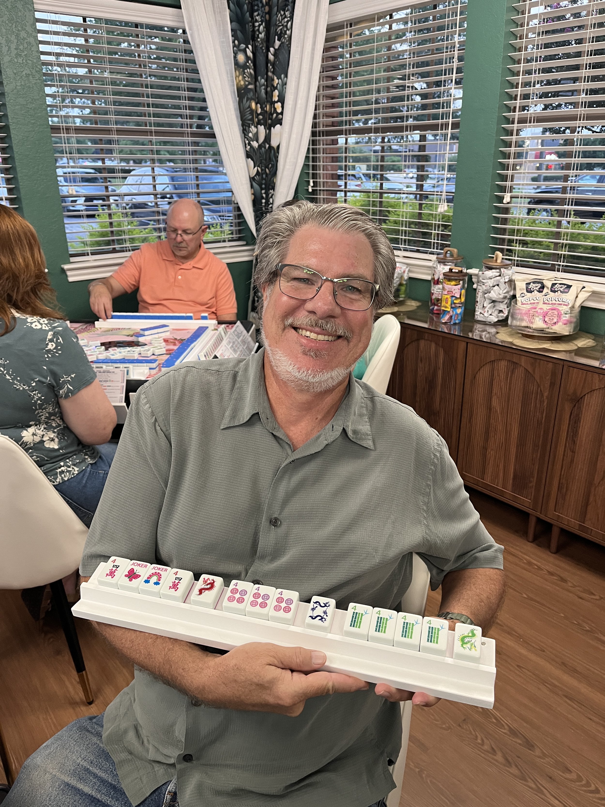 man showing a mahjong rack