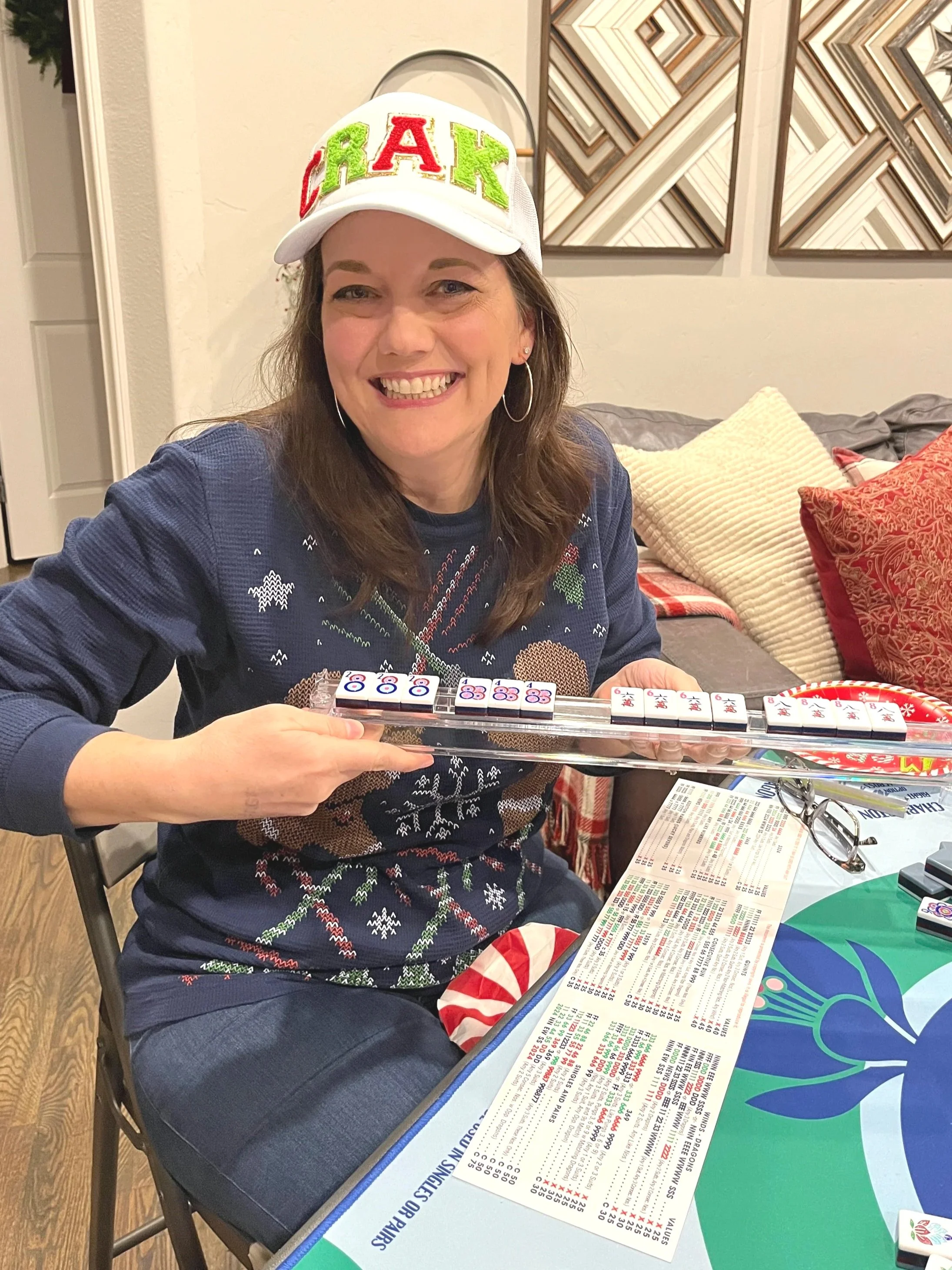 Woman playing mahjong holding rack