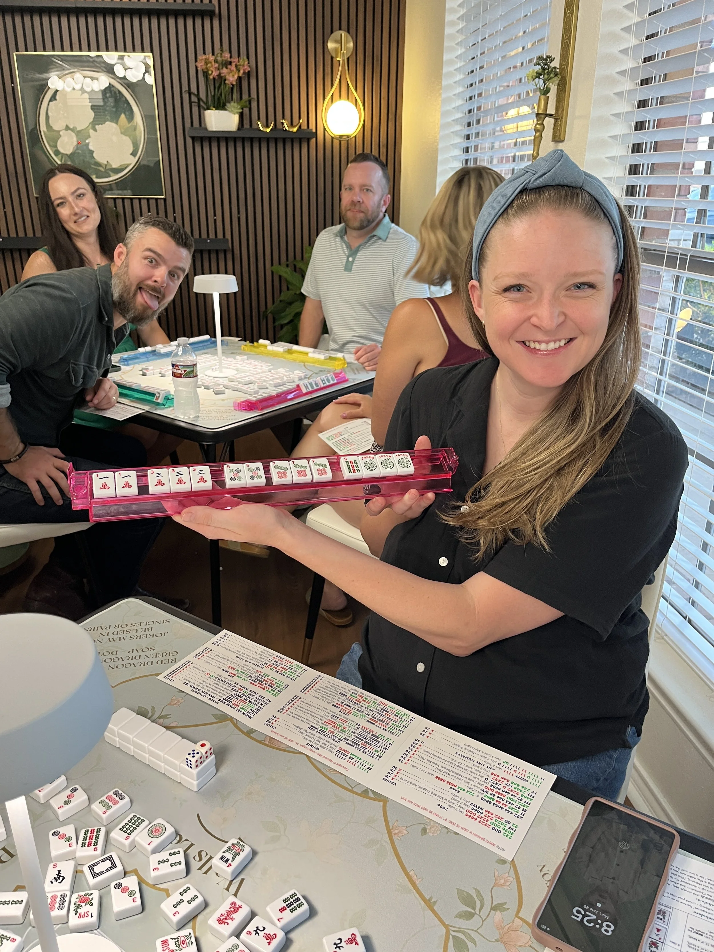 woman holding a mahjong rack