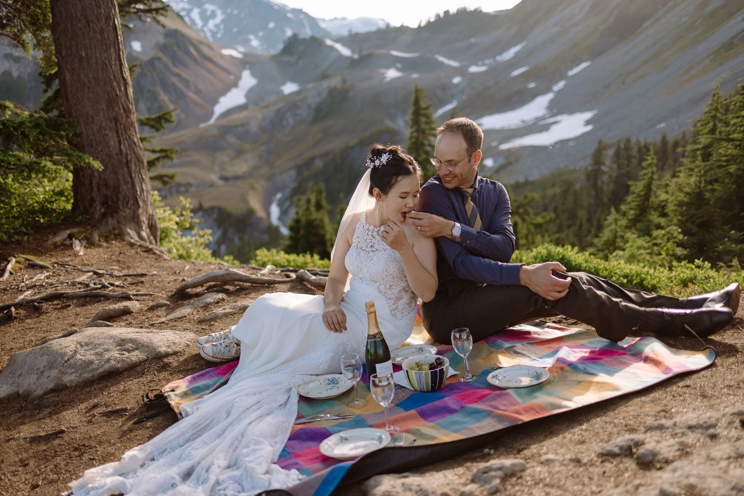 Couple enjoying the picnic after their elopement at Artist Point in the North Cascades, Washington.