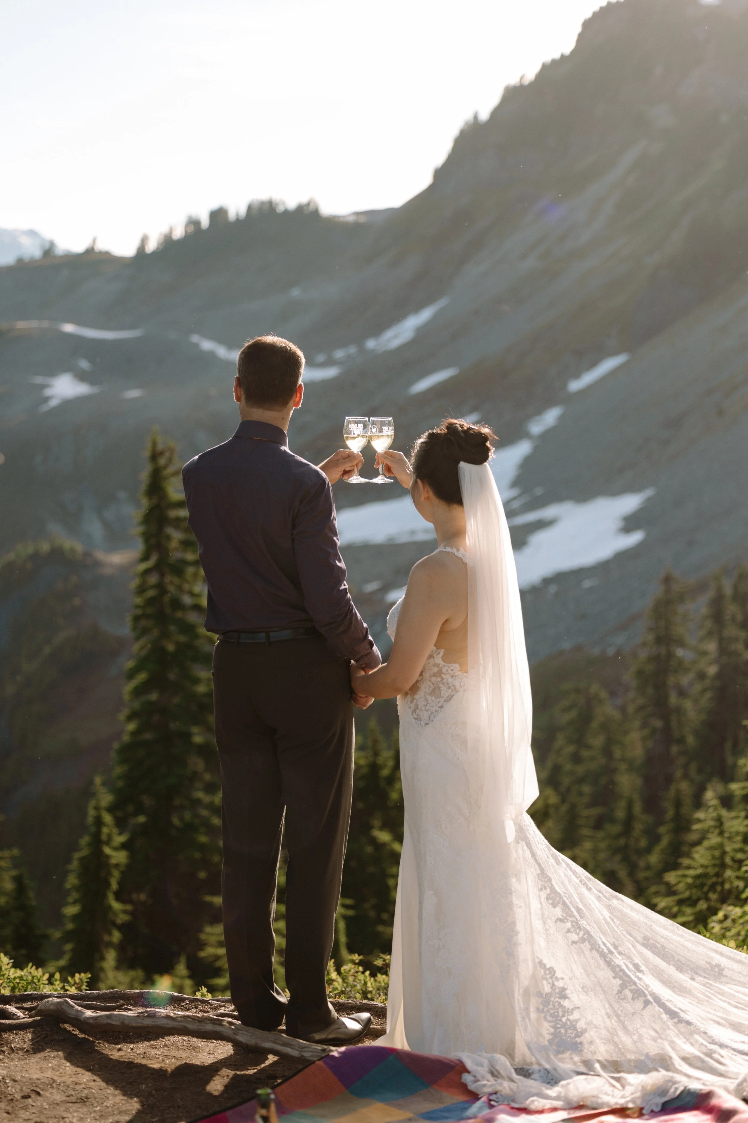 Couple enjoying the picnic after their elopement at Artist Point in the North Cascades, Washington.