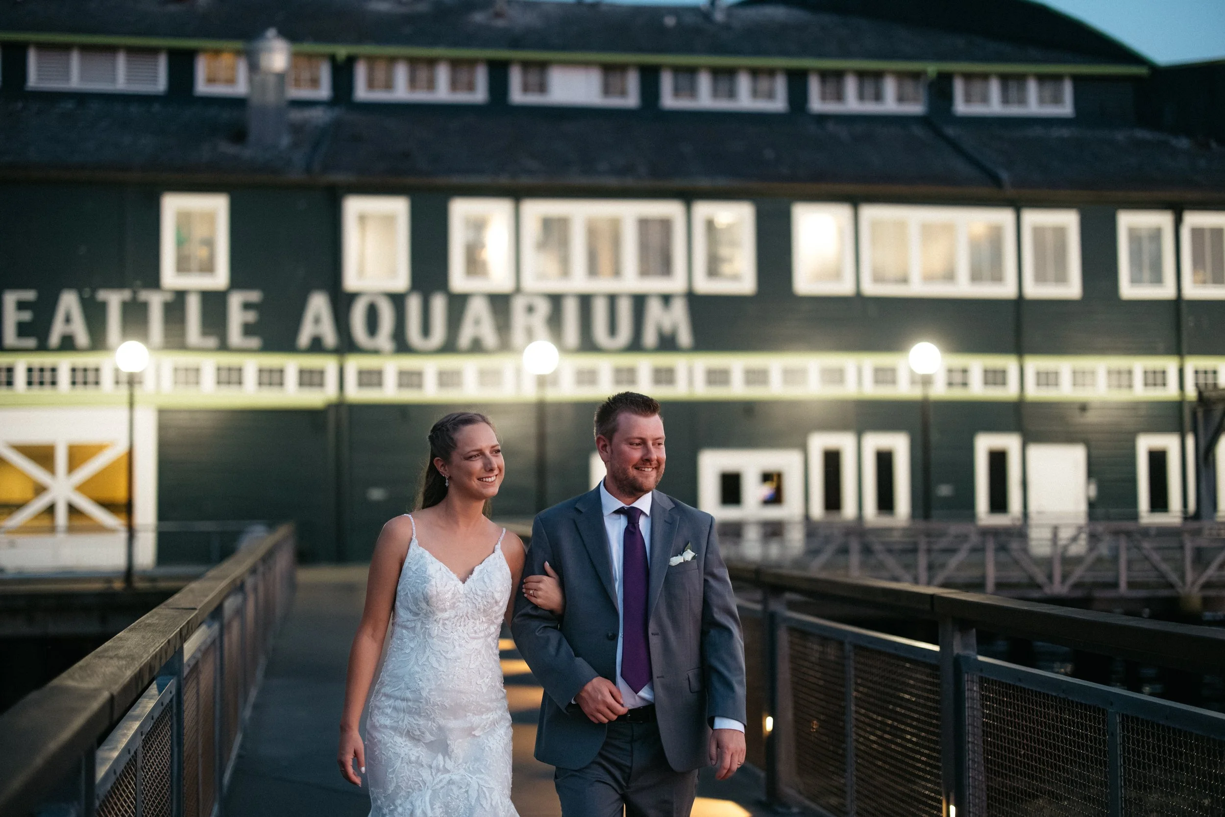 Evening wedding portraits outside the Seattle Aquarium in Seattle.