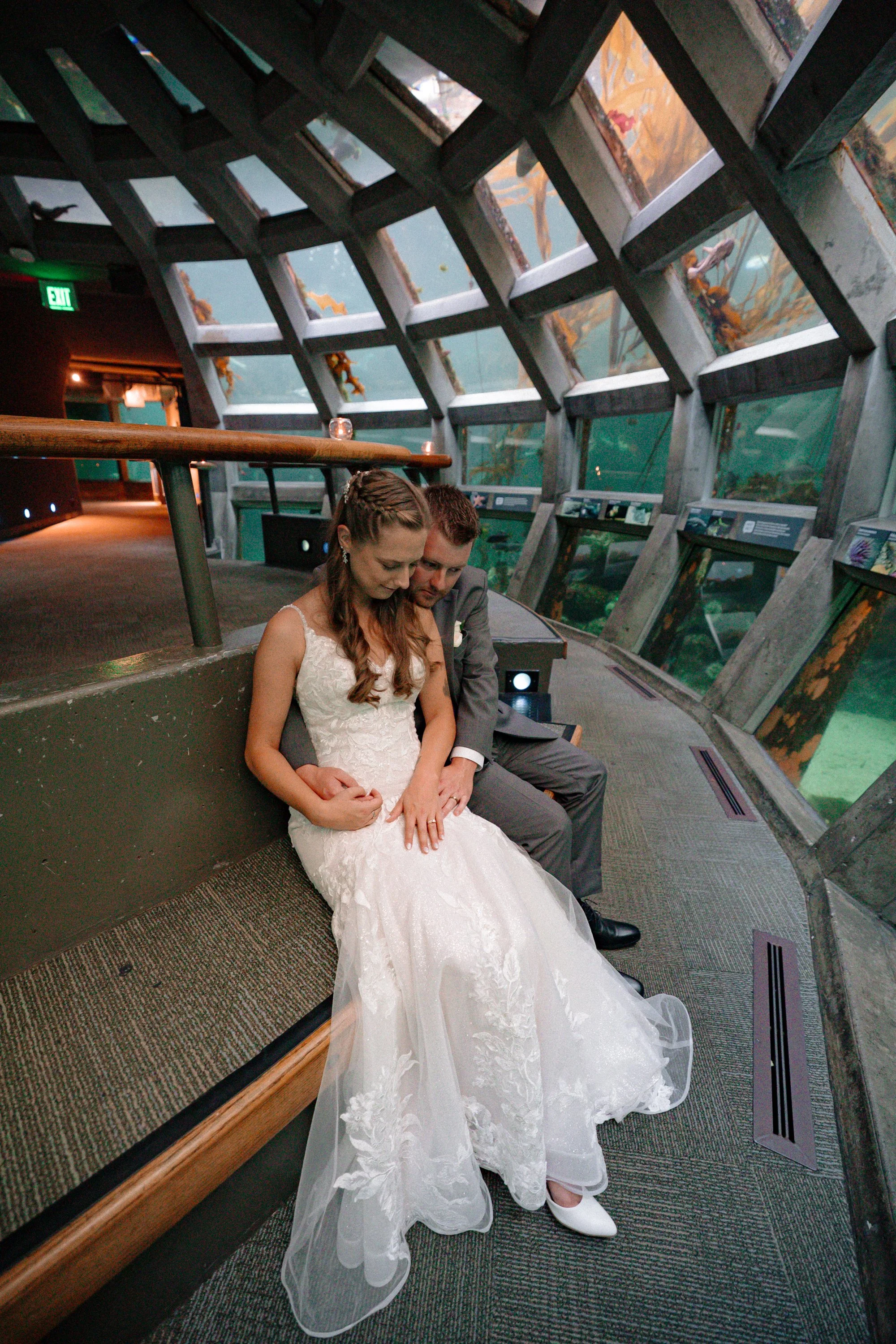 Wedding portraits inside the Seattle Aquarium underwater gallery.