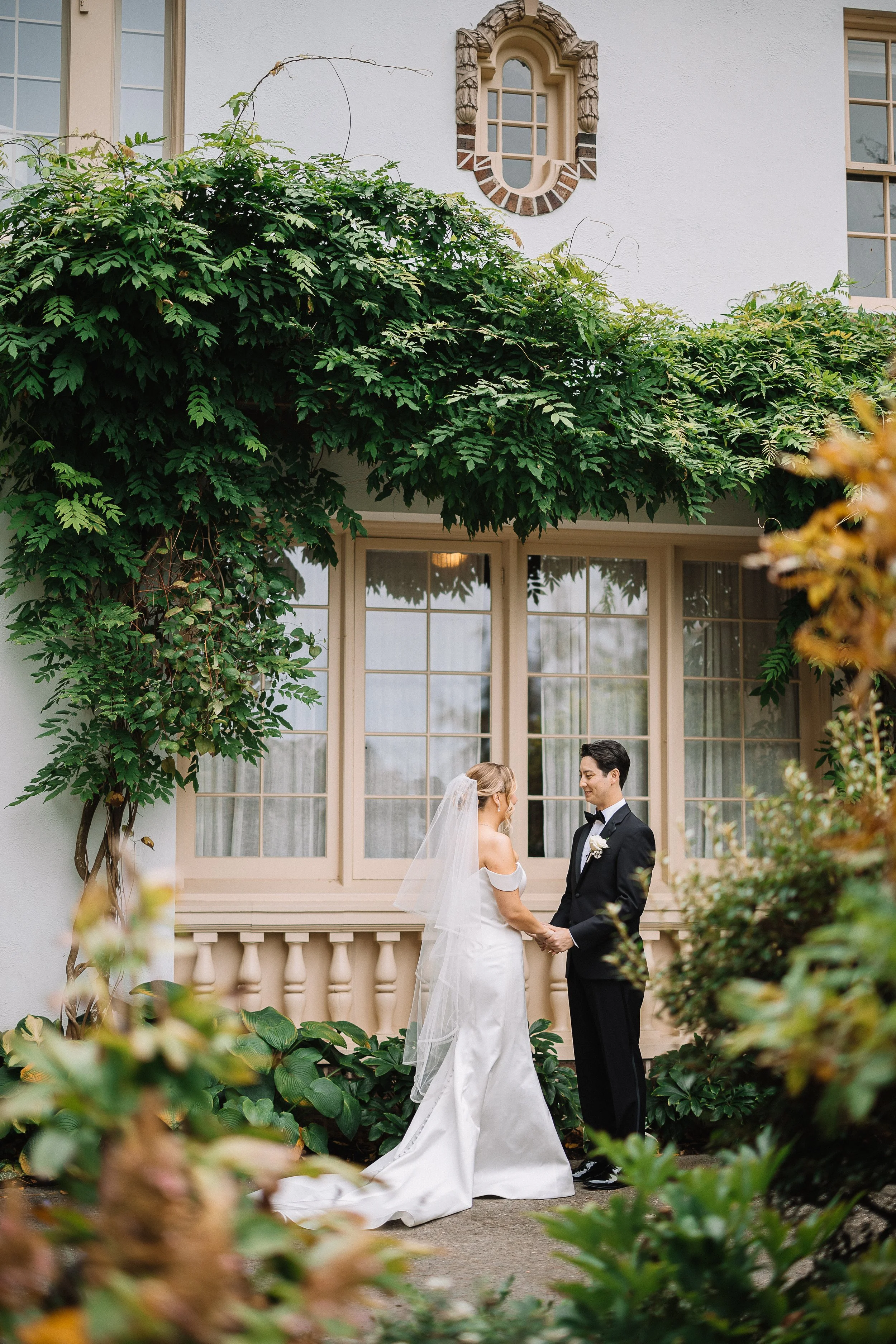 Lairmont Manor wedding venue in Bellingham. A bride and groom holding hands during their private vows before the ceremony.
