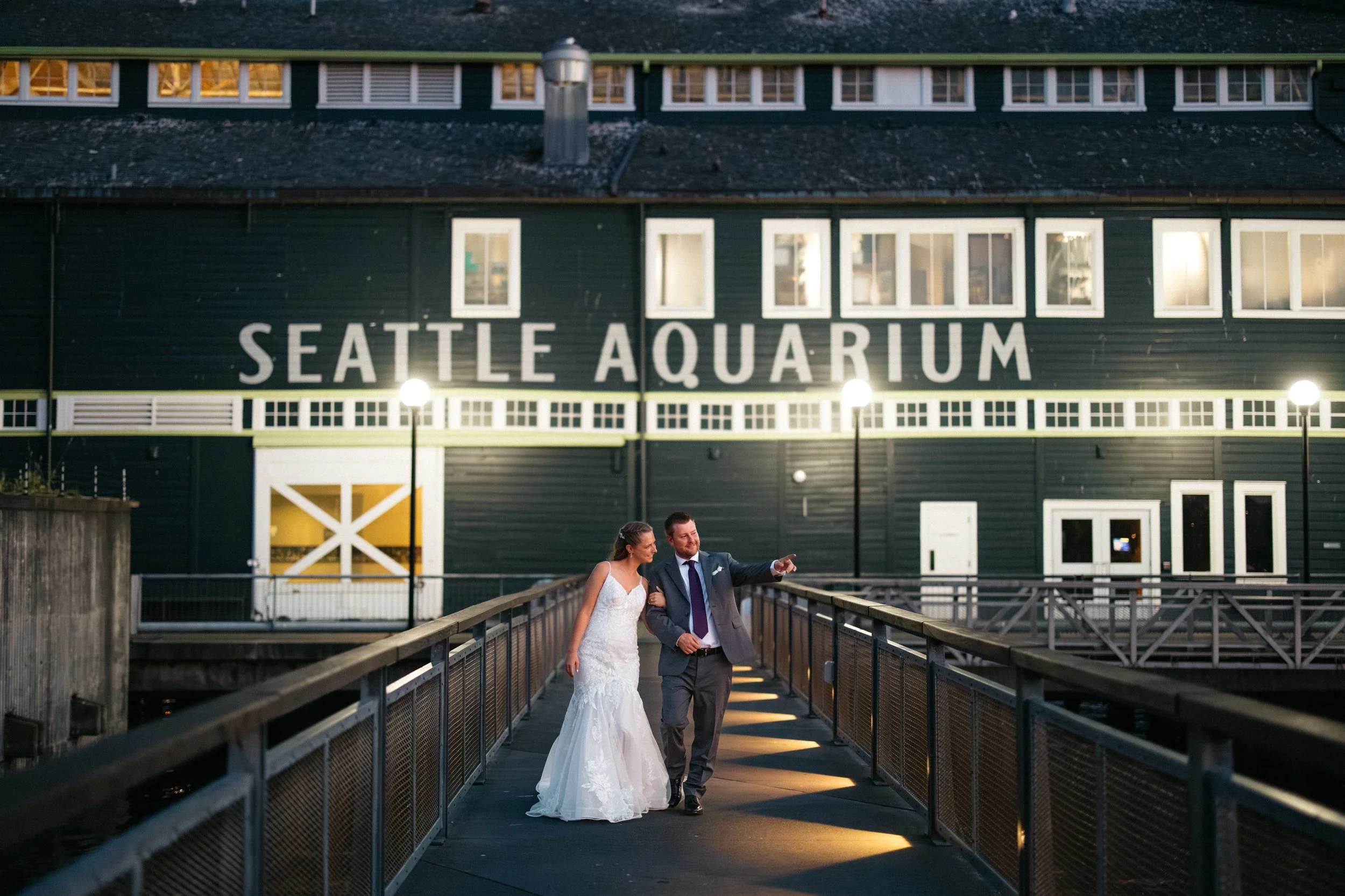 Evening wedding portraits outside the Seattle Aquarium in Seattle.