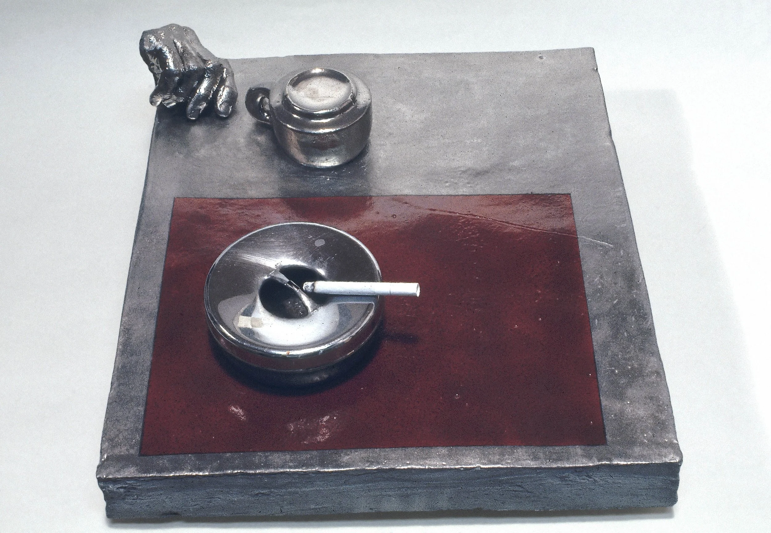 Photo Negative with Ashtray on Red Table, 1968, stoneware with glaze and ashtray, 14.5" x 16.5"
