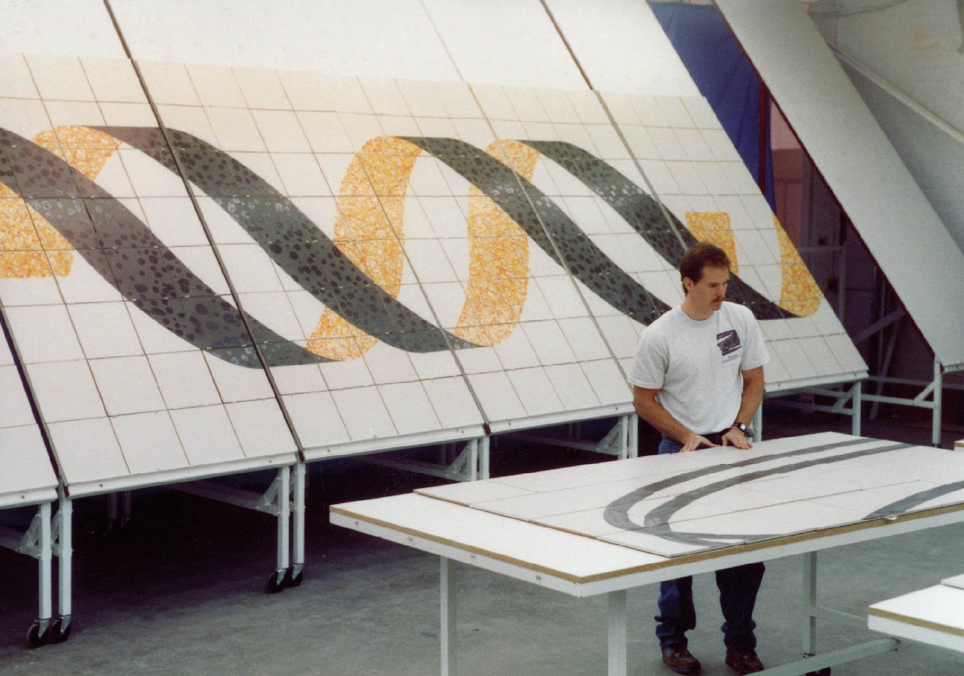 Creating tile for Coming to Light at the Tile Guild, Los Angeles, California, 1990
