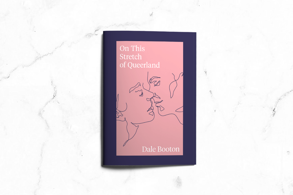 A book titled "On This Stretch of Queerland" by Dale Booton with a pink cover and line art of two faces in profile on a dark blue background, placed on a white marble surface.