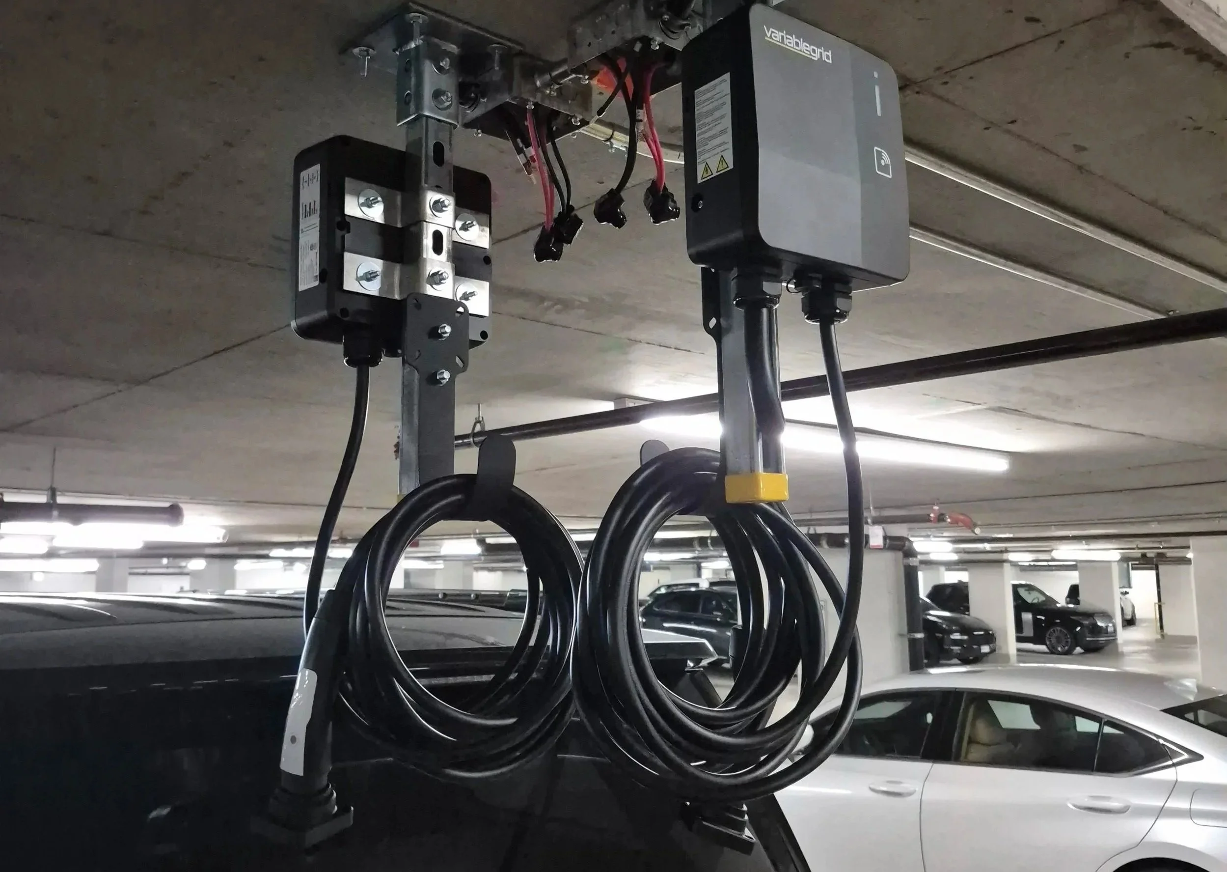 Electric vehicle charging station in an underground parking garage.