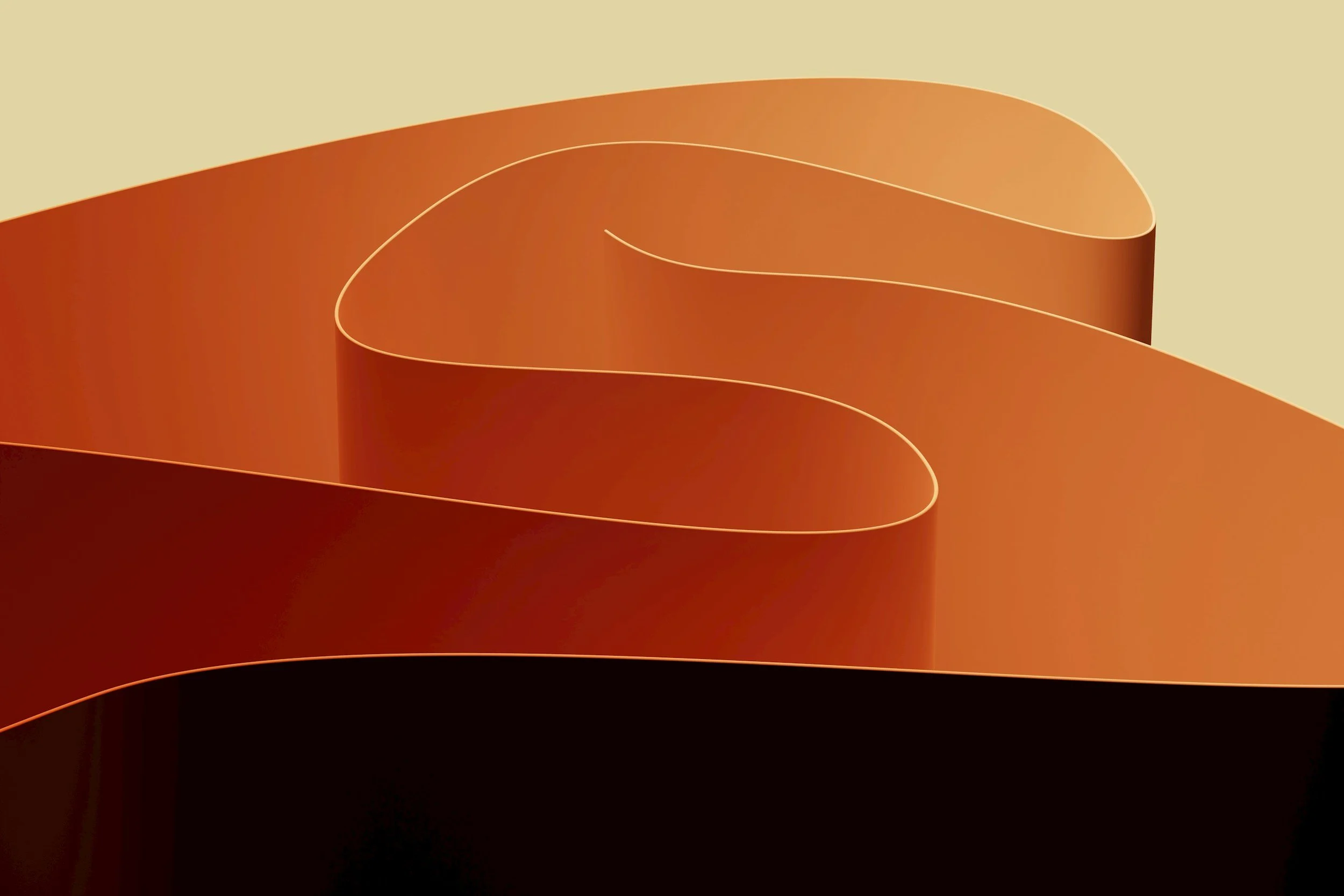 Close-up of a metallic ribbon sculpture with orange and black colors.