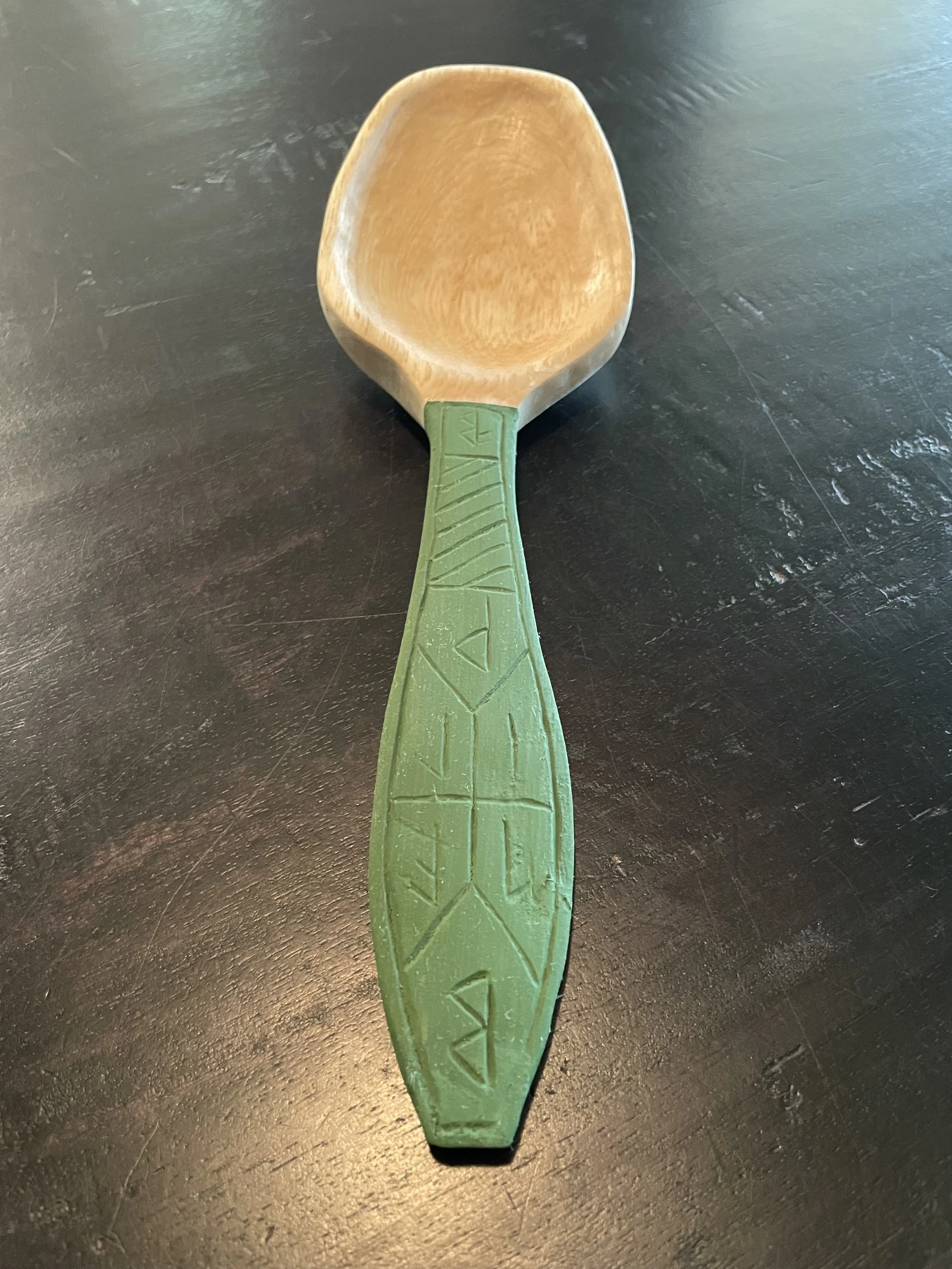 Magnolia cooking spoon with hand-carved runes. Colored with green milk paint.