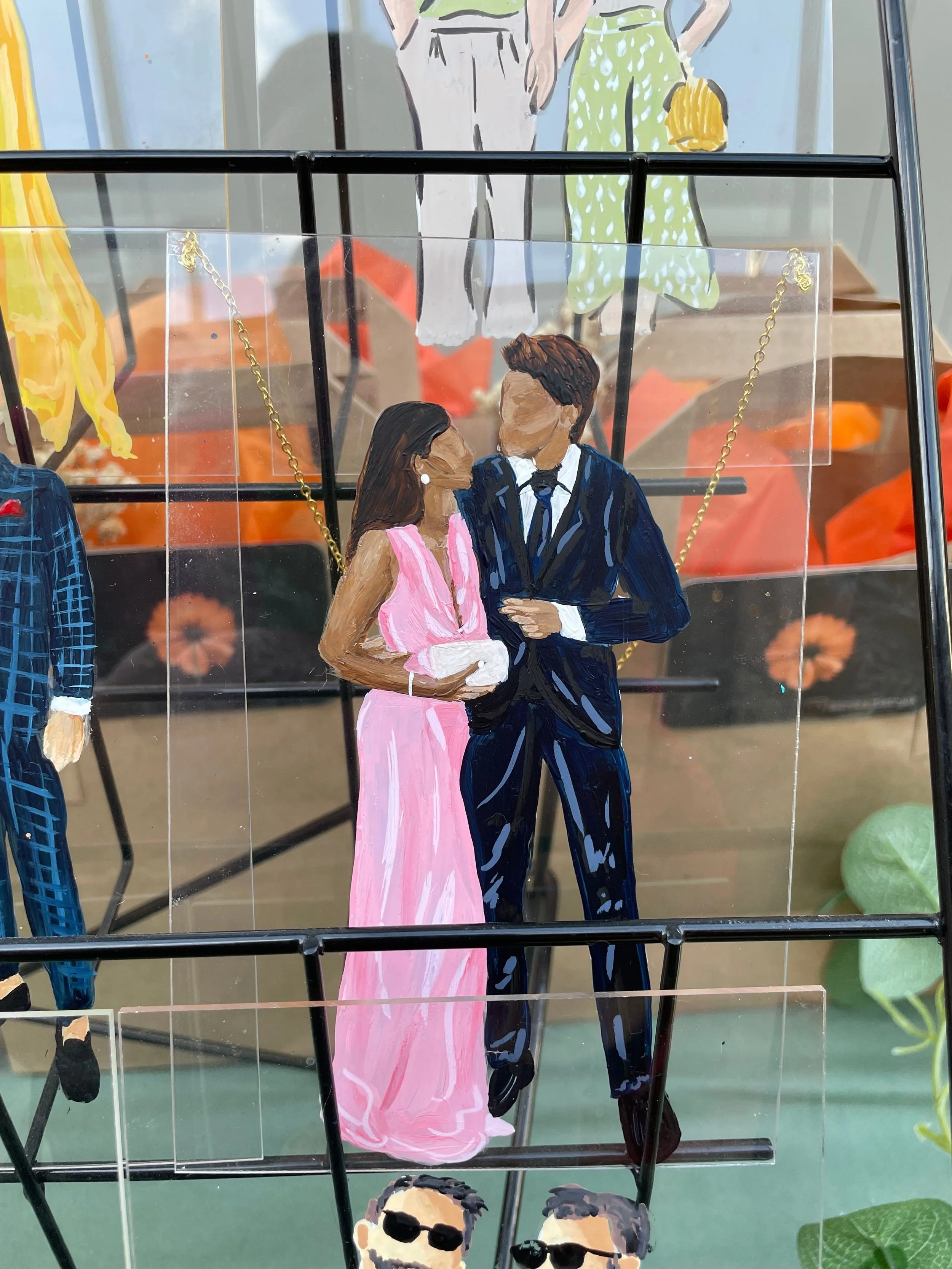 A painted illustration of a couple, with the woman wearing a pink dress and the man in a dark blue suit, standing close and looking at each other.