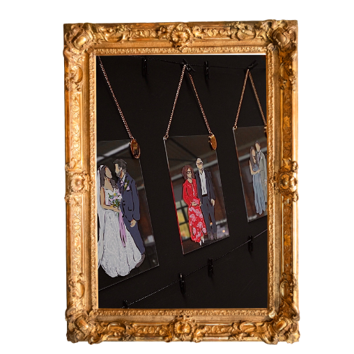 Live wedding illustrations hanging inside an ornate gold picture frame, each featuring a different illustration of couples in vintage clothing.