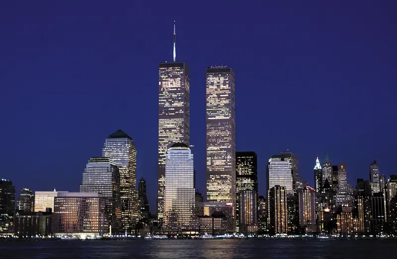 Night view of the New York City skyline with the Twin Towers of the World Trade Center illuminated