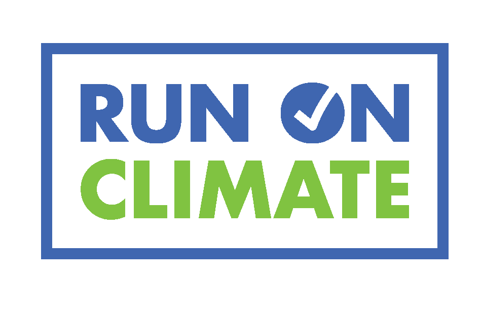 A campaign sign with the words "RUN ON CLIMATE" in large blue and green letters, with the "O" in "ON" replaced by a checkmark inside a circle, framed by a blue border.