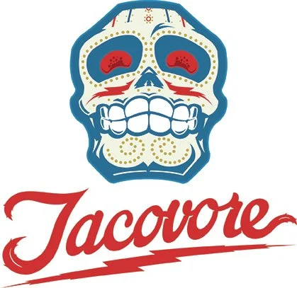A colorful sugar skull design with the word 'Jacovore' written in red cursive below.
