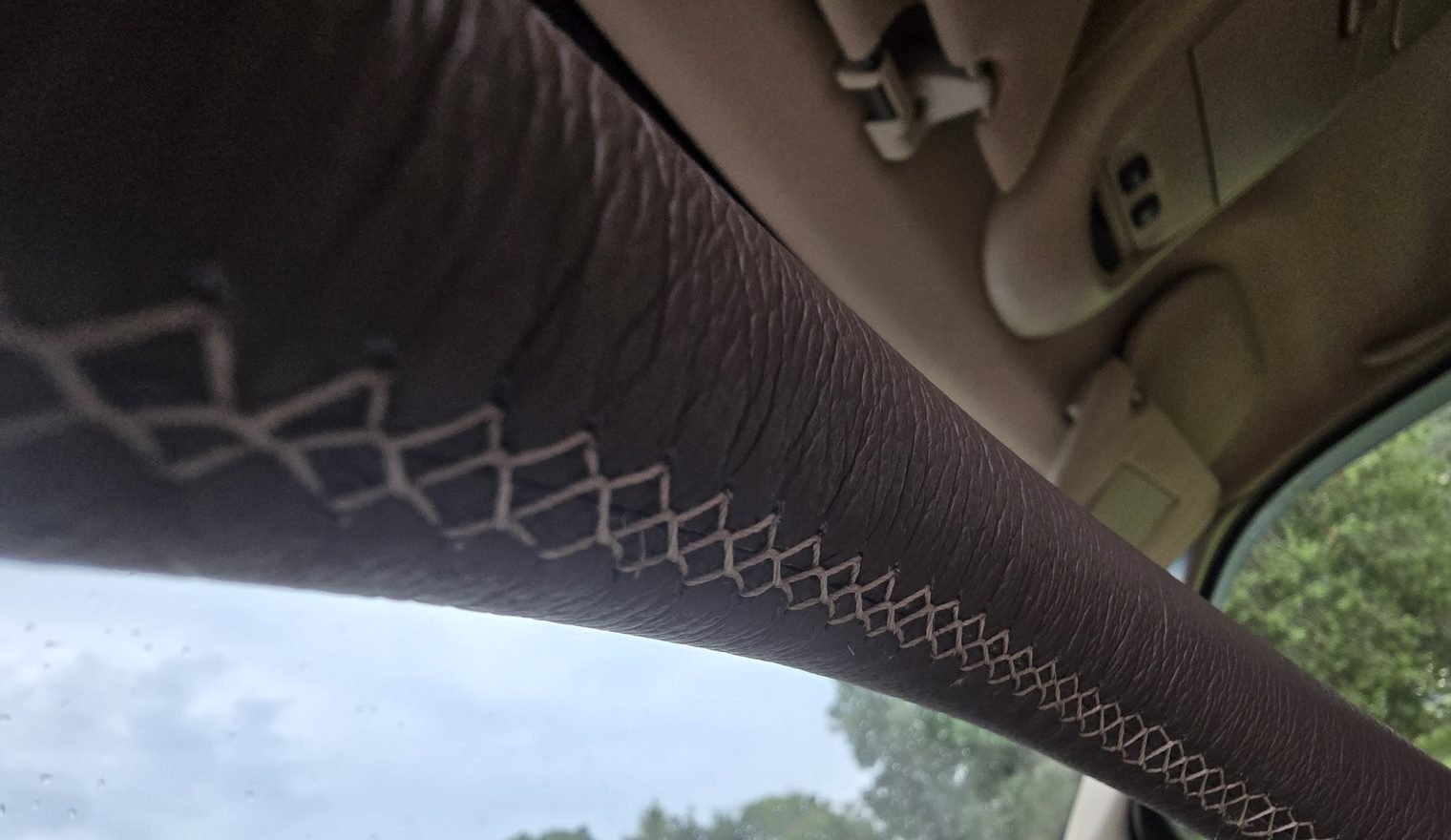 Close-up of the cross stitching on our RJW custom wheel wrap (RJW work, not a Katzkin product).