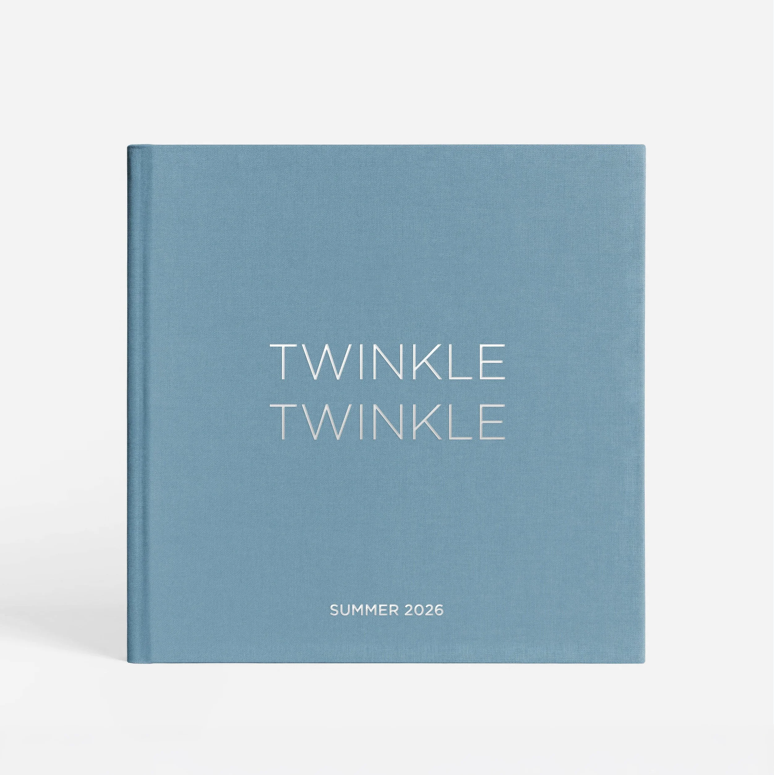 A blue graduation cap with the word 'TWINKE' printed in white across the front, and 'SUMMER 2026' written below, against a light background.