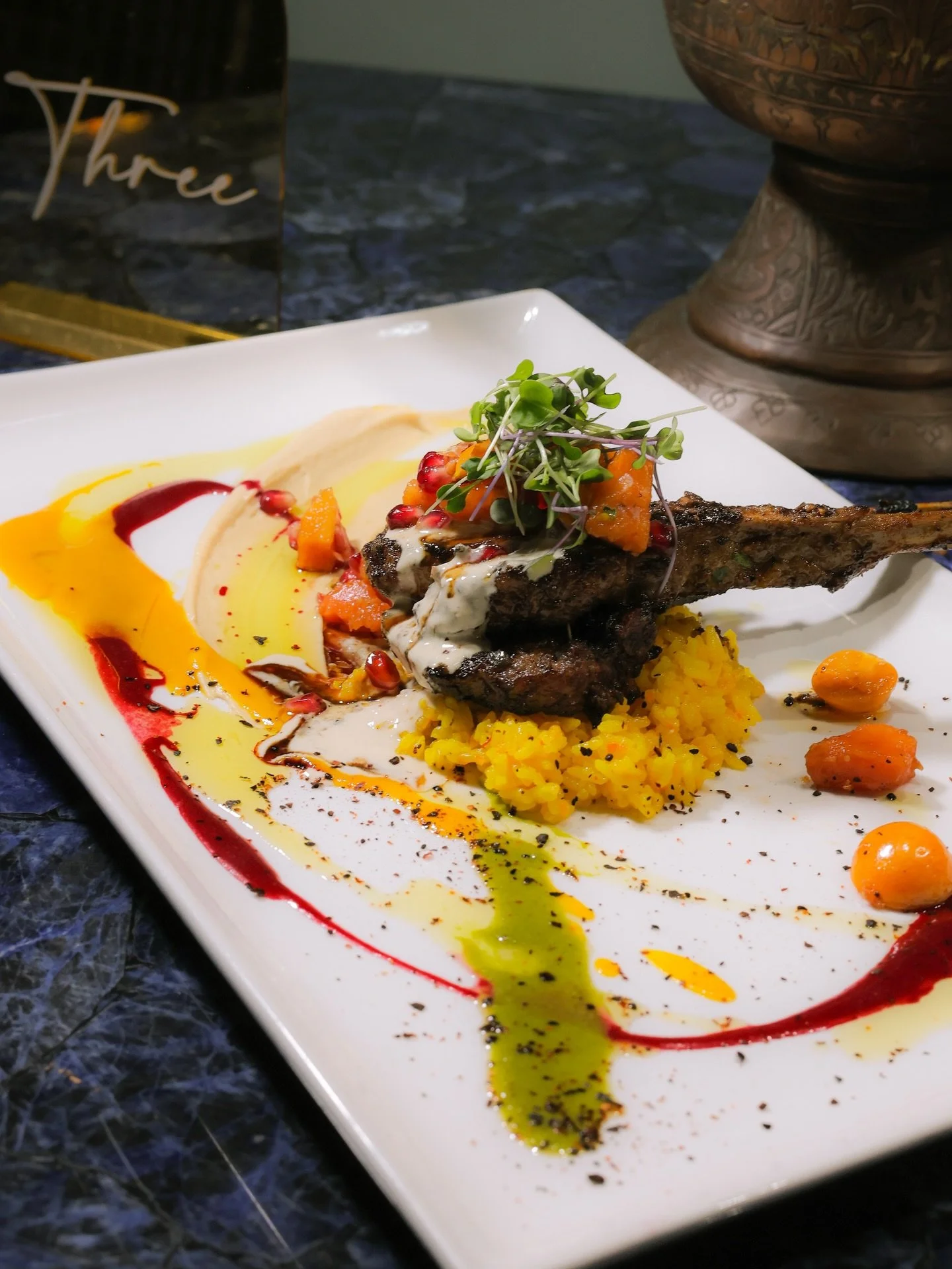 Our incredible lamb chops! Served with saffron rice, homemade hummus, pomegranate salad 😋❤️🍽️