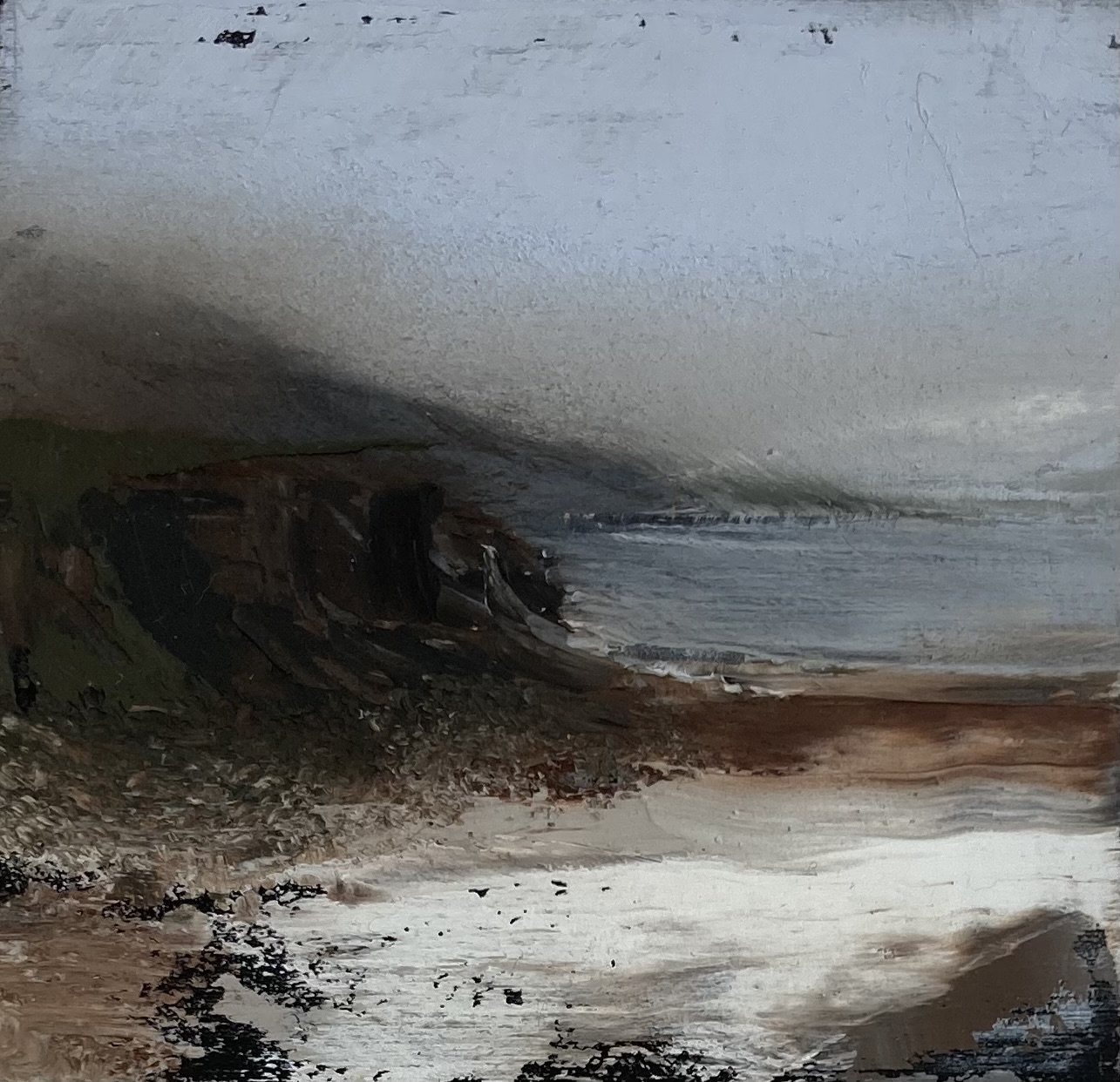 Moody oil painting of a rugged coastal landscape with dark cliffs and a beach.