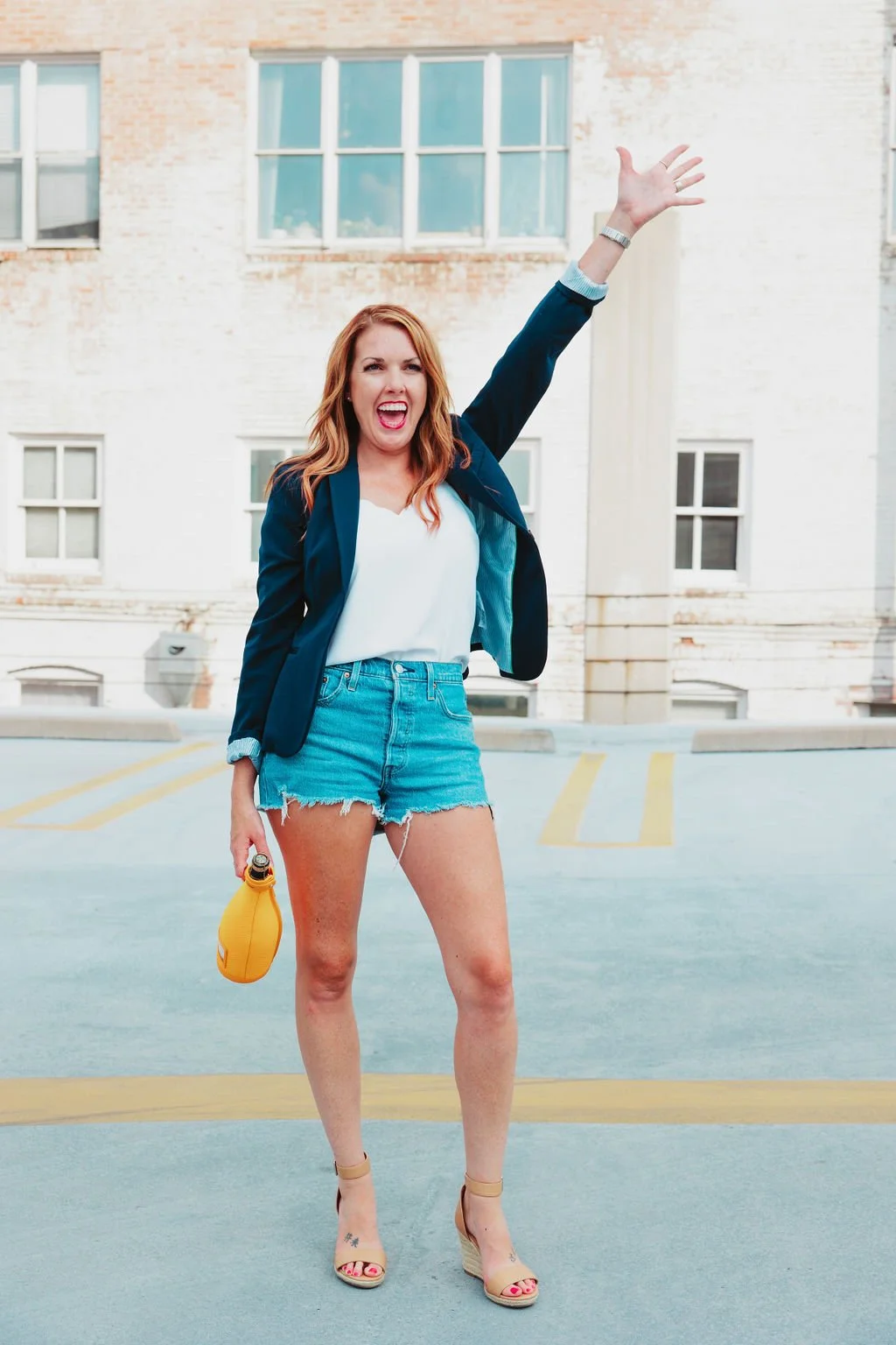 Thornton Realtor celebrating a sold home with a bottle of champagne and a huge smiel