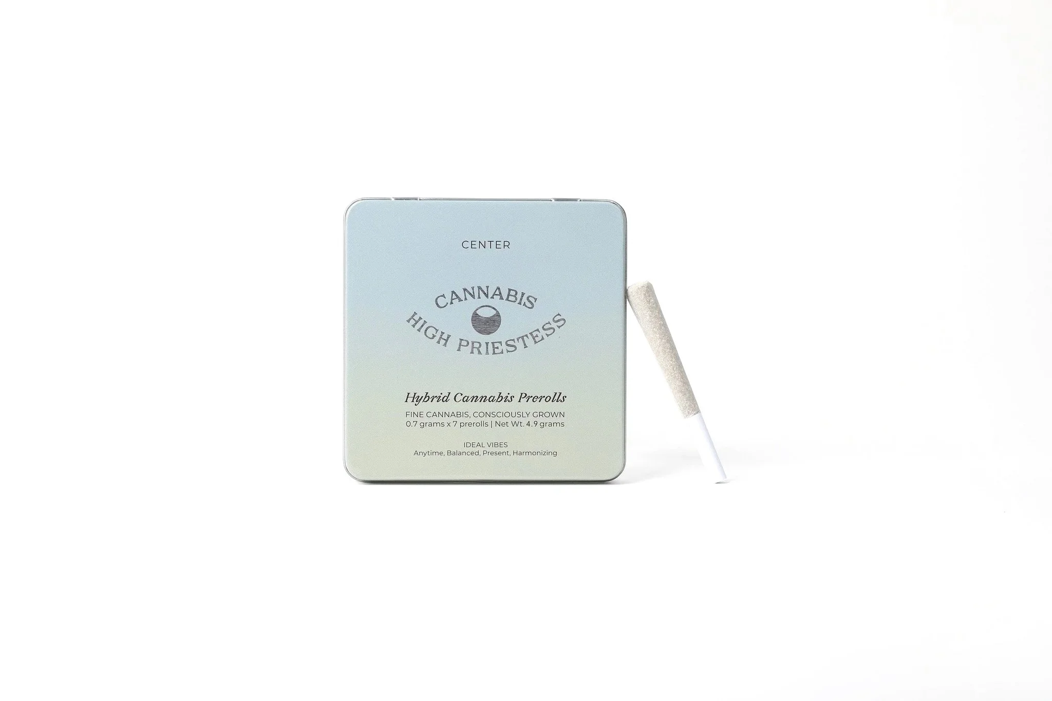 An image of a green and blue gradient HIGH PRIESTESS Hybrid cannabis tins on a white background with single joint leaning on the tin.
