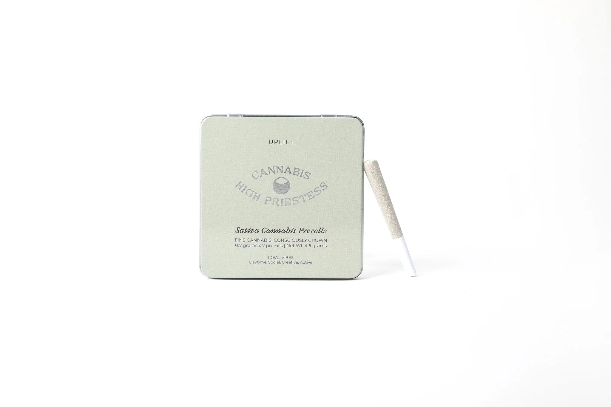 An image of a green HIGH PRIESTESS Sativa cannabis tins on a white background with single joint leaning on the tin.