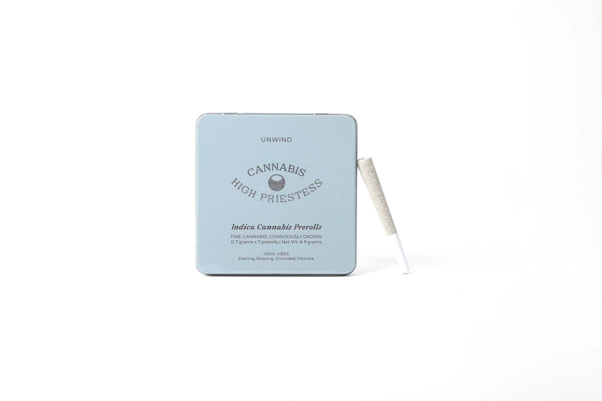 An image of a blue HIGH PRIESTESS Indica cannabis tins on a white background with single joint leaning on the tin.