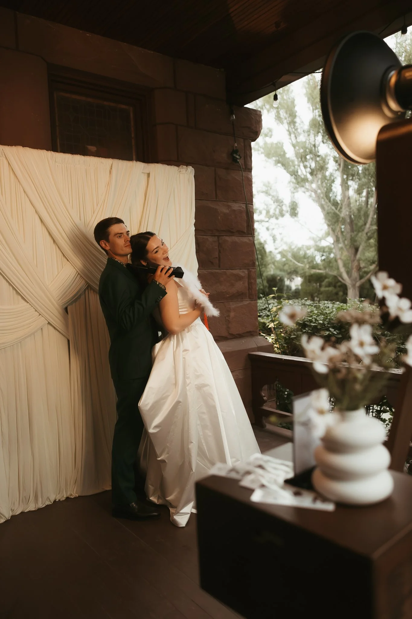 Montana Photo Booth Rental Couple using the photo booth and posing with props