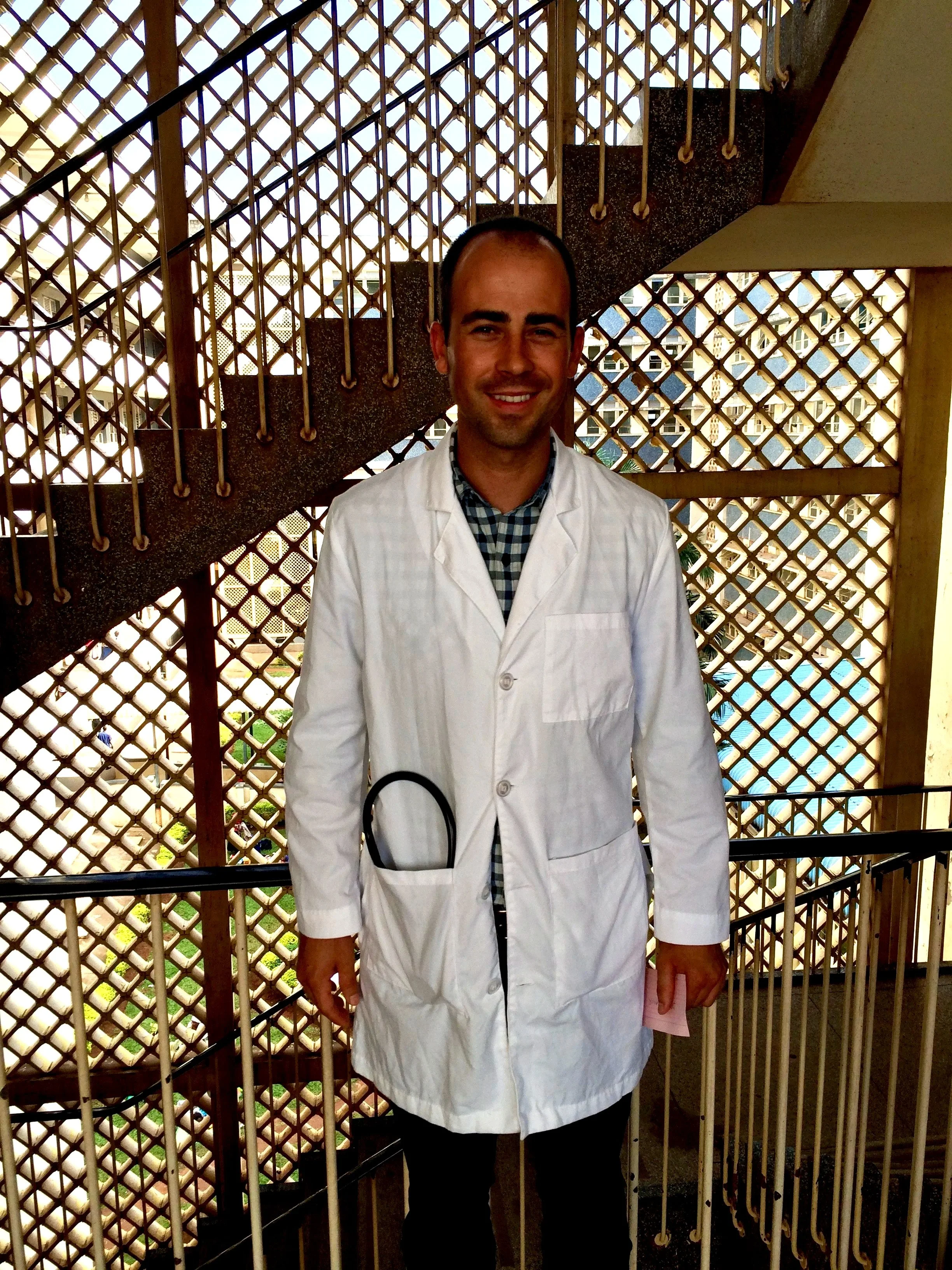 Dr. Bias in the stairwell of Mulago National referral hospital in Uganda.