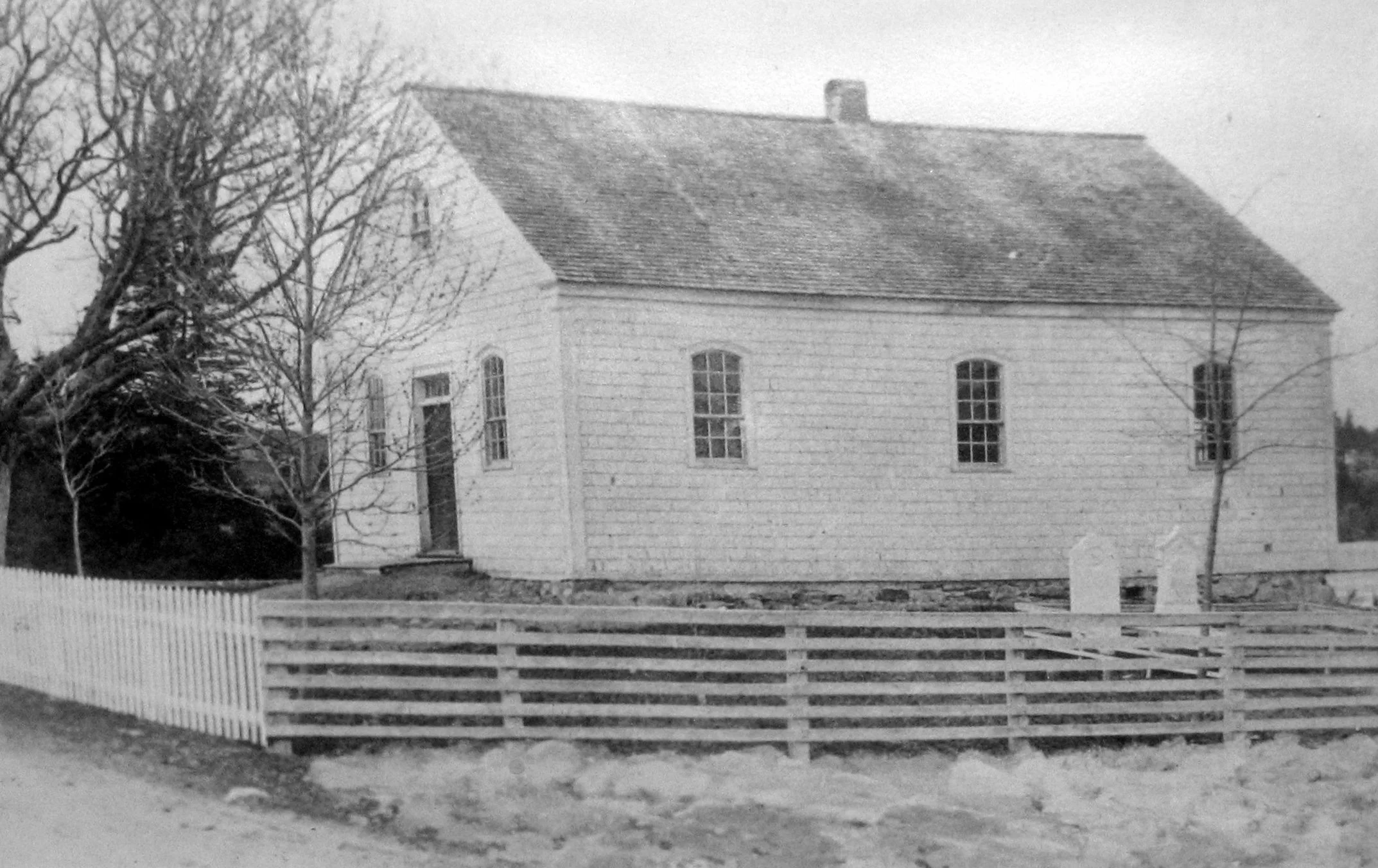 William Black Memorial United Church circa 1893. The simple rectangular building has no steeple but shows a chimney at the building's centre that is no longer there. The original windows have 9 small panes over 6, with arched tops.