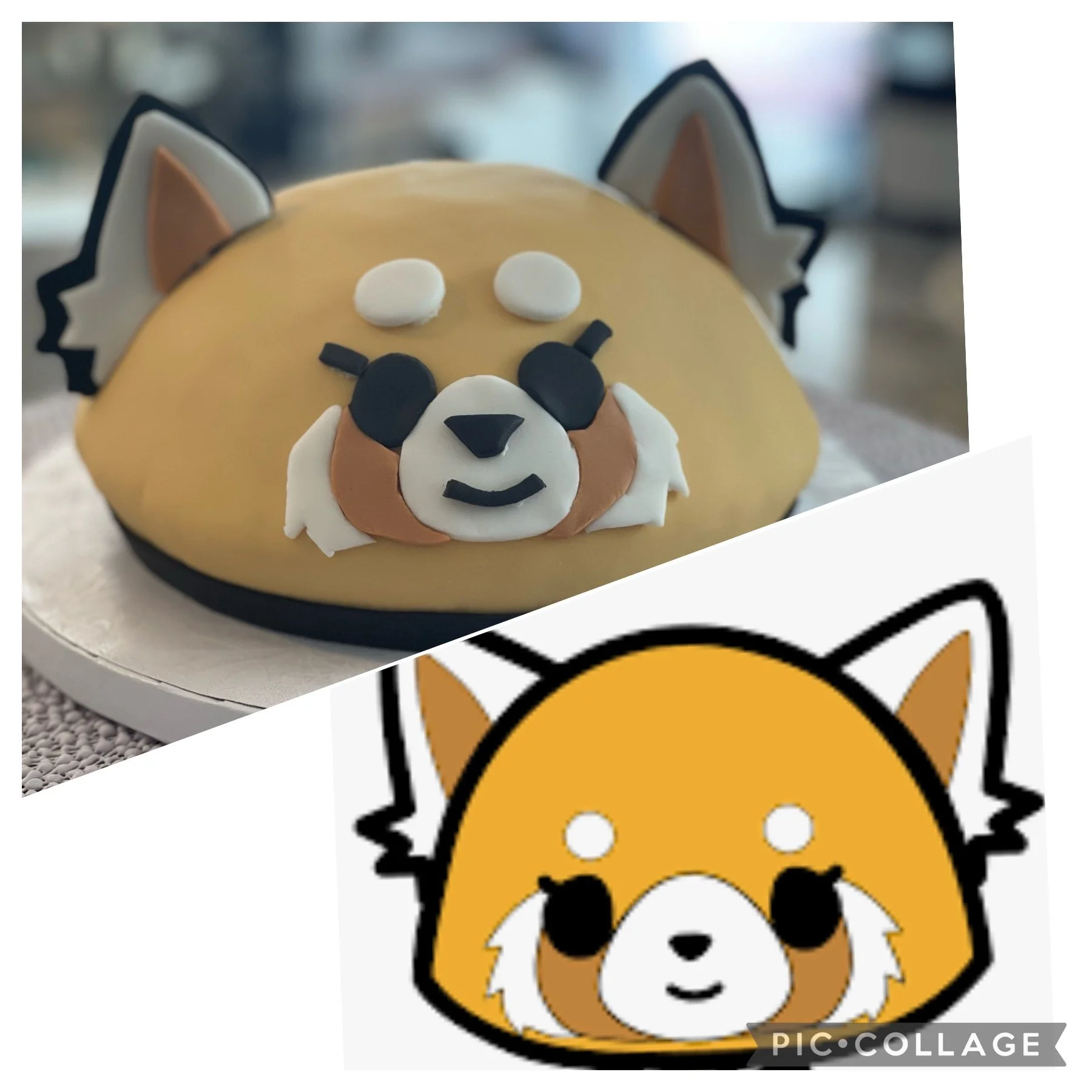 A cake decorated as a cute dog with a yellow face, white cheeks, black eyes, a small black nose, and a slight smile. The cake has large pointy ears with black and brown details, and is placed on a silver cake board.