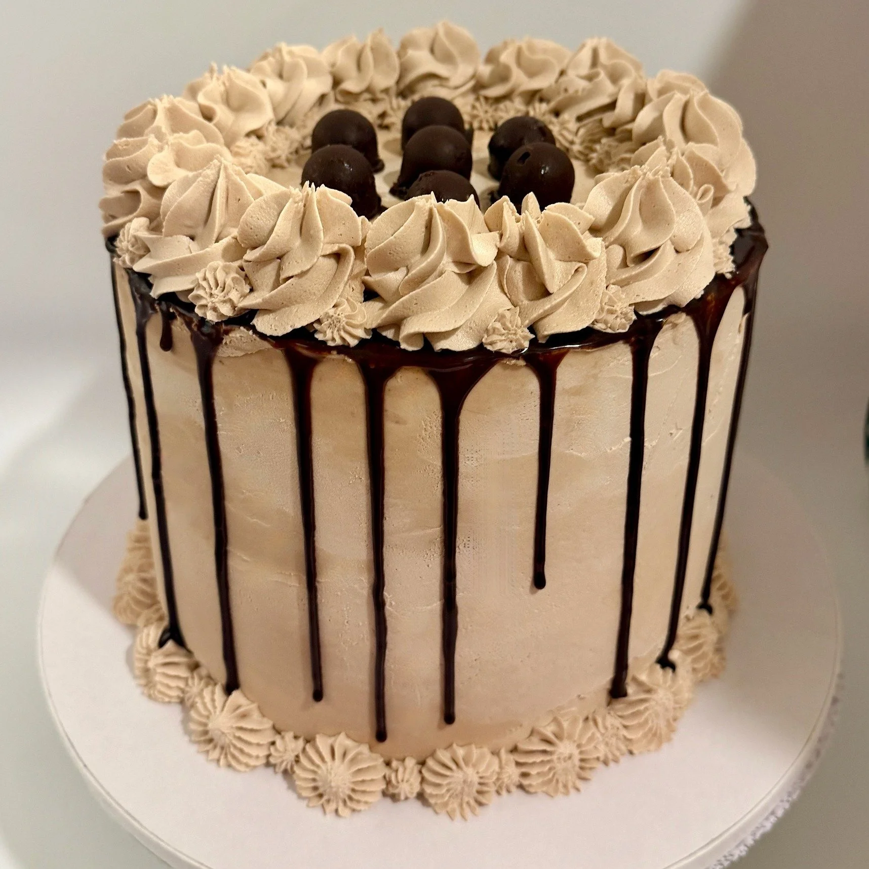 Nutella Cake - Chocolate cake with nutella ganache filling, nutella buttercream, nutella ganache drip, and homemade nutella truffles on top.  #nutella #glutenfreecakes #mncottagefood