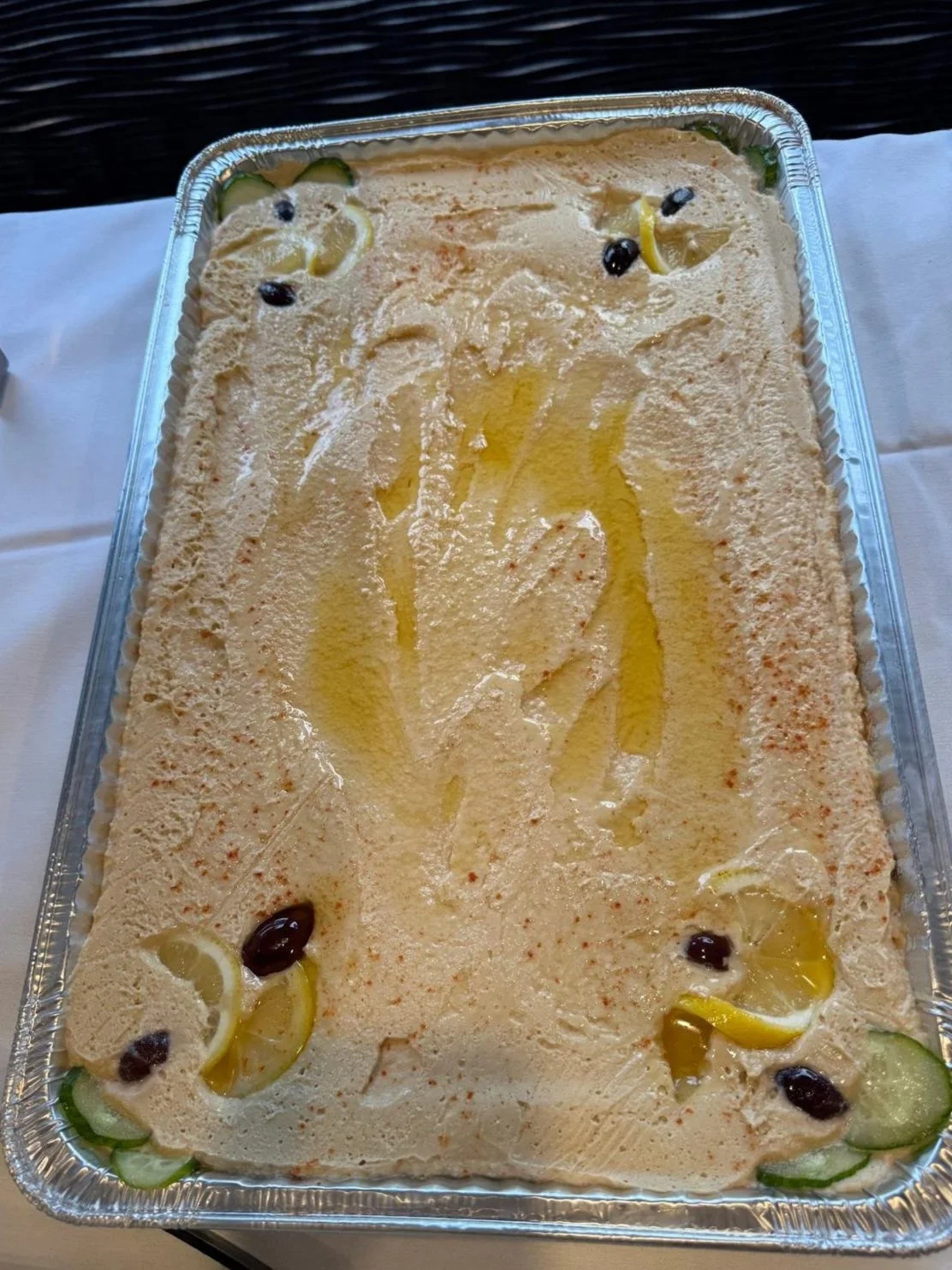 A tray of Hummus. Crystal Palace is a caterer and banquet hall in Mt Prospect that specializes in Mediterranean food.