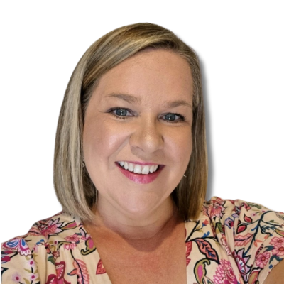 Smiling woman with short blonde hair wearing a floral dress